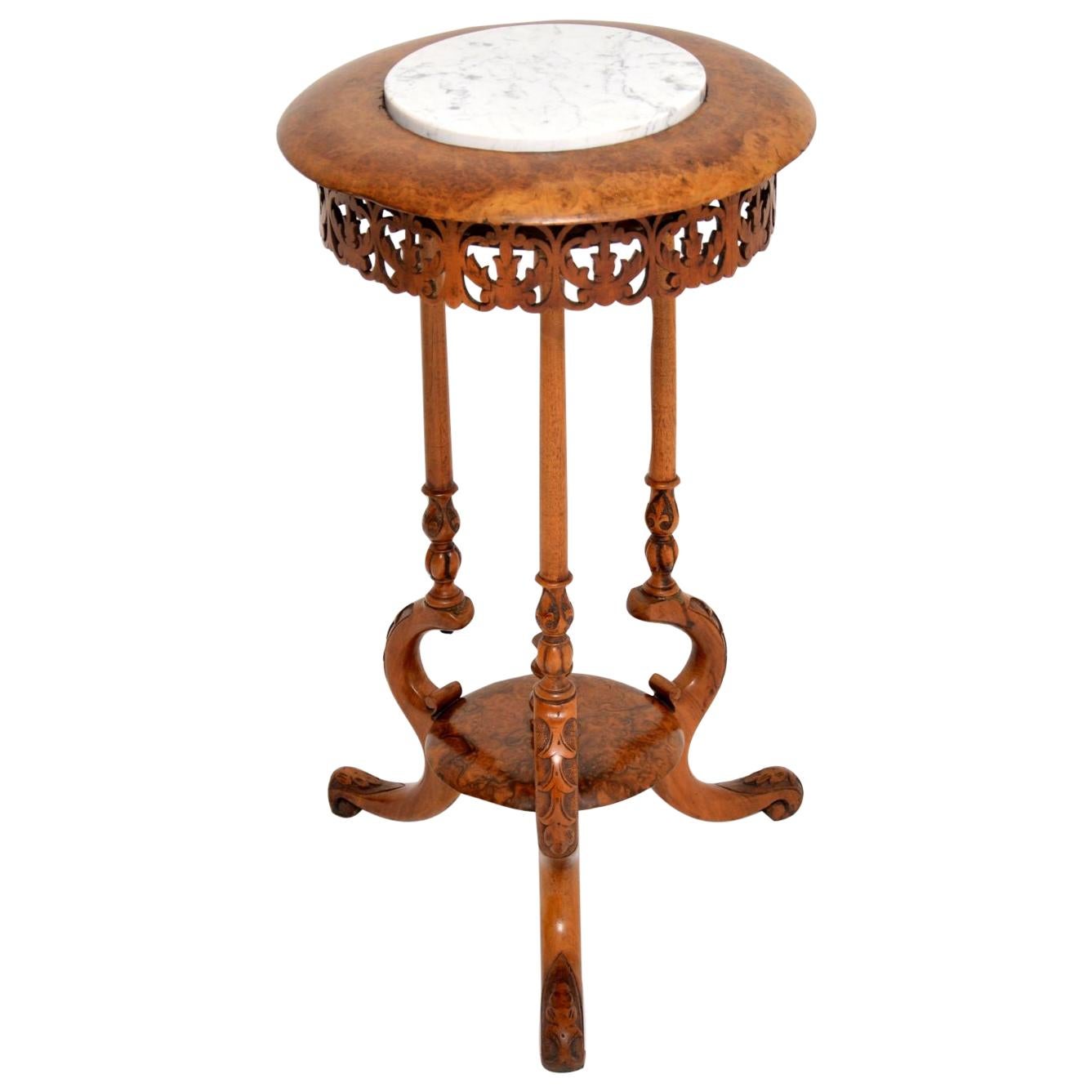 Very decorative antique Victorian walnut jardinière stand dating from circa 1860s period and in very good condition, with all the original pieces of wood intact.

It’s surprisingly stabile, given the design and general structure. The marble top
