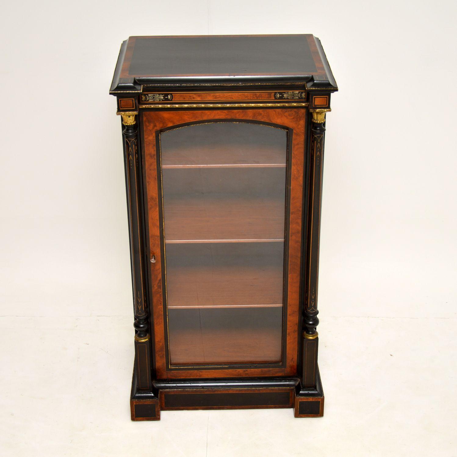 A beautiful and high quality antique Victorian cabinet, dating from around the 1860-80 period.

This is extremely well made, and has a beautiful combination of burr walnut, ebonised wood and original brass mounts. The attention to detail is