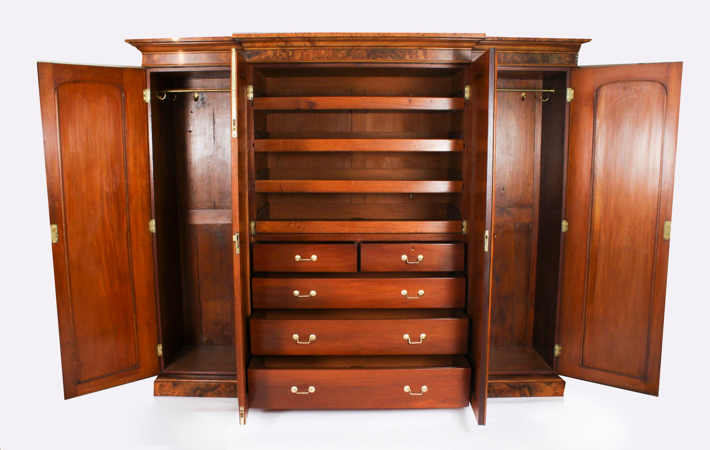 This is a fantastic quality Victorian burr walnut wardrobe with four decorative burr walnut panelled doors, Circa 1880 in date.

The decorative outswept cornice sits above four panel doors. The side doors open to reveal full-length garment-hanging