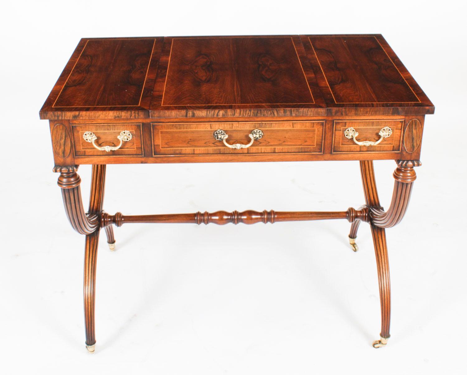 This is a fabulous antique  late Victorian burr walnut games and writing table, circa 1890 in date.

It is made of beautiful burr walnut that has elegant satinwood line inlaid banding. The sliding top opens and can be removed to reveal a fabulous
