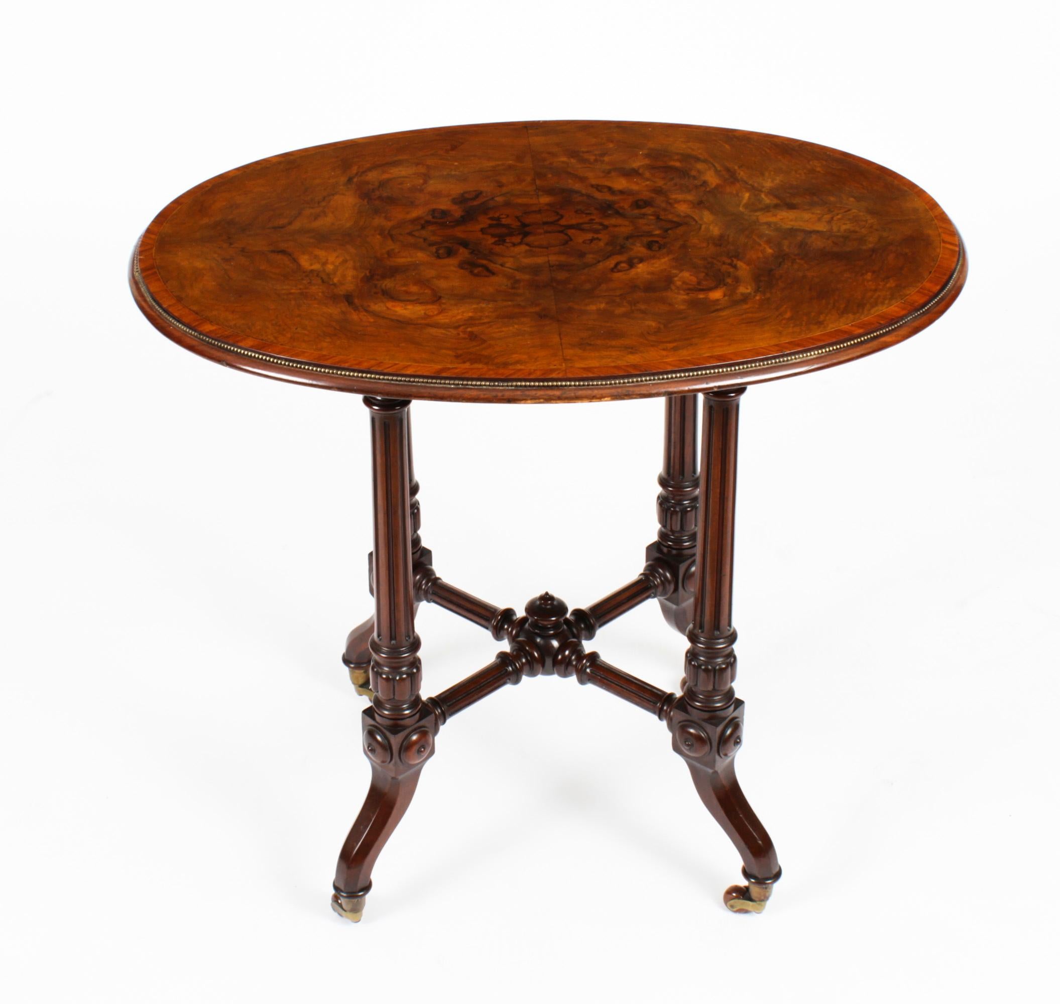 This elegantly proportioned antique Victorian burr walnut occasional table dates from circa 1870.
 
This table has been masterfully crafted with an oval top raised on a four carved walnut legs that terminate in their original brass and porcelain