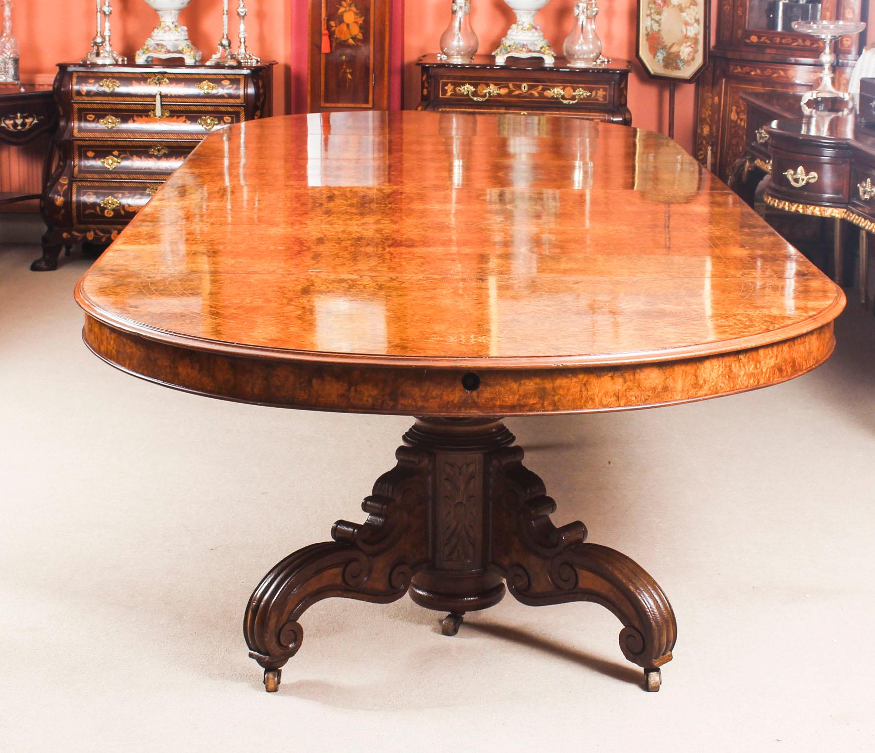 This is a magnificent antique Victorian split base burr walnut dining table circa 1880 in date.

It has been hand crafted from burr walnut, and the beautiful top has been masterfullt inlaid with wonderful marquetry decoration.

The four leaves