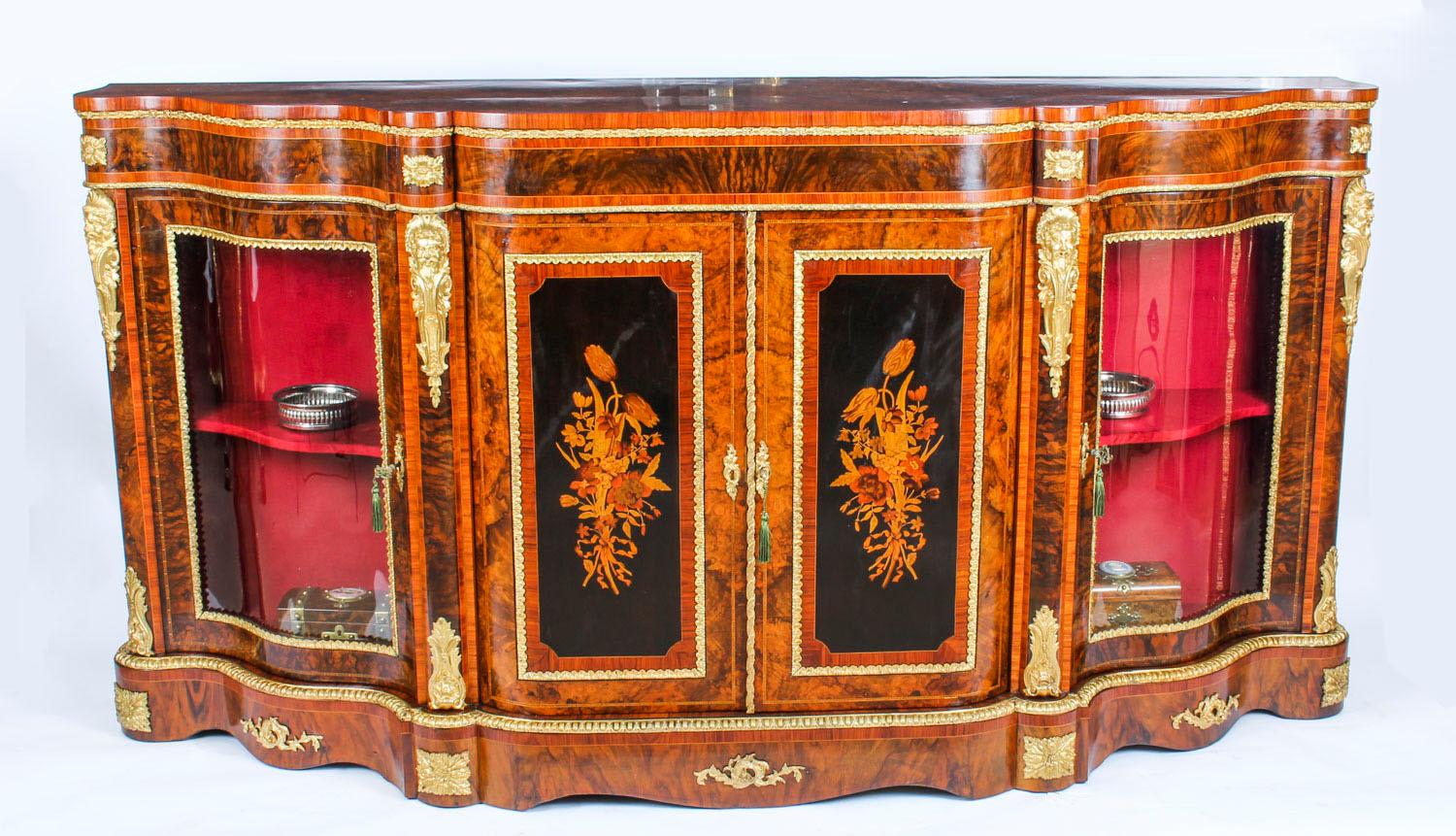 This is a superb antique Victorian ormolu mounted burr walnut and floral marquetry inlaid credenza, circa 1860 in date.

Oozing sophistication and charm, this credenza is the absolute epitome of Victorian high society.

The entire piece highlights