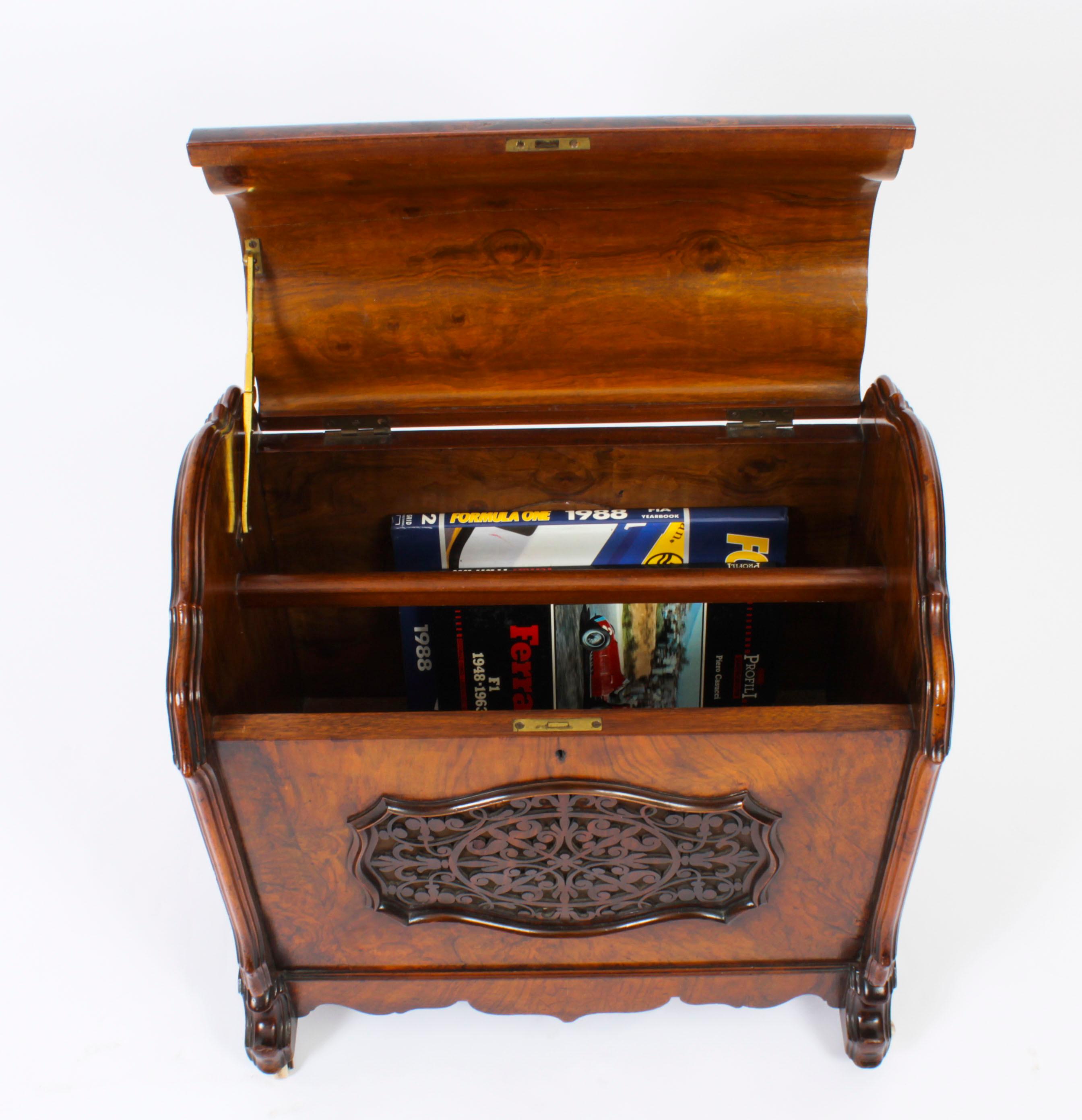 This is a gorgeous antique Victorian burr walnut pierced and carved enclosed Canterbury circa 1870 in date.
 
The grain of the burr walnut is truly beautiful.

It features a hinged top opening to a divided interior. The sides are fitted with