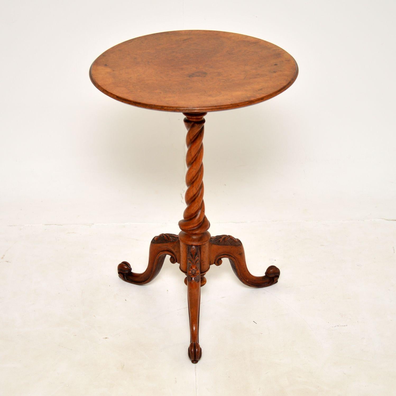 A gorgeous original antique Victorian occasional table in burr walnut. This was made in England, it dates from around the 1860-1880 period.

It has a stunning solid walnut barley twist base with a beautifully carved tripod base. The top has lovely