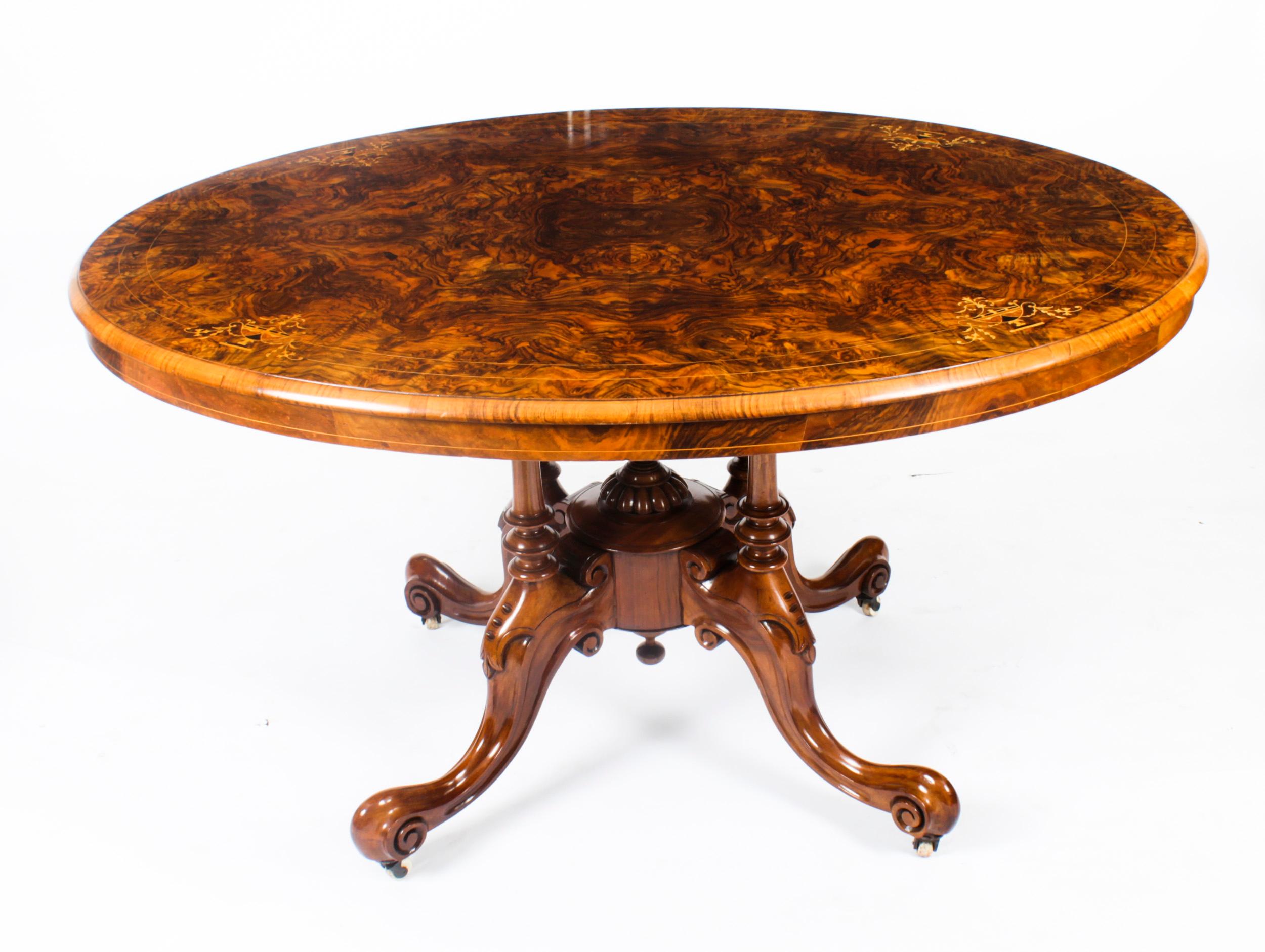 This is a superb large Victorian oval burr walnut Loo table, circa 1860 in date.
 
The beautifully figured quarter veneered oval tilt top table features superb marquetry inlaid decoration, a wonderful moulded edge and a shaped frieze. It is raised