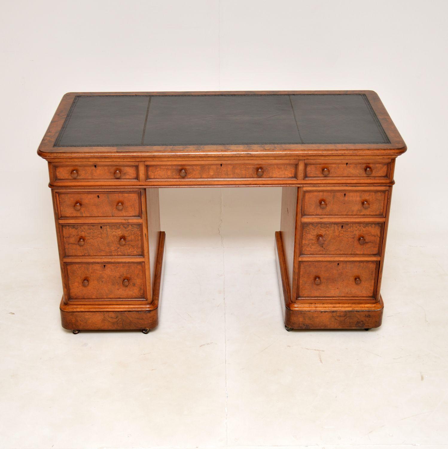 An excellent antique Victorian pedestal desk in walnut, this was made in England and date from around the 1860-1880 period.

The quality is outstanding, this is so very well made and is a useful size. The top edges, drawer fronts have stunning burr