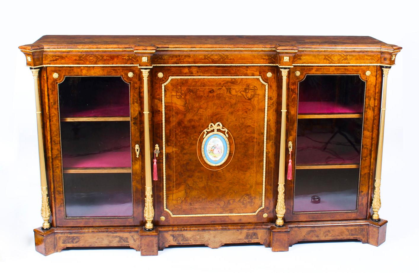 This is a superb antique Victorian burr walnut, Sevres Porcelain and ormolu mounted breakfront credenza, circa 1860 in date.
 
The well figured burr walnut top with perfectly matched veneers above a rectangular door centred with an oval Sevres