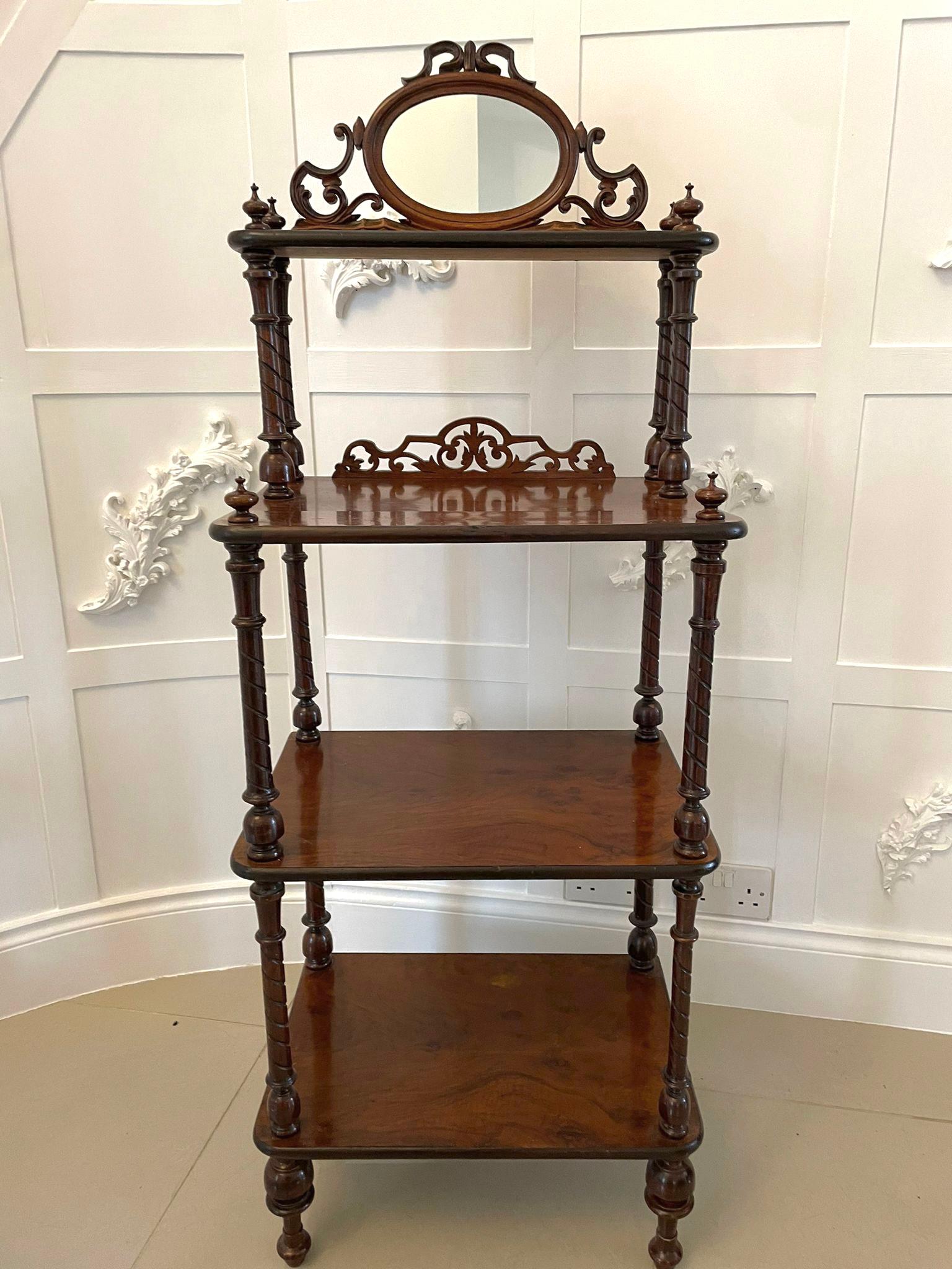 Antique Victorian burr walnut whatnot having a shaped oval mirror in a pierced walnut frame above four burr walnut shelves supported by twelve solid walnut turned reeded columns raised on four original turned legs

A beautifully crafted decorative