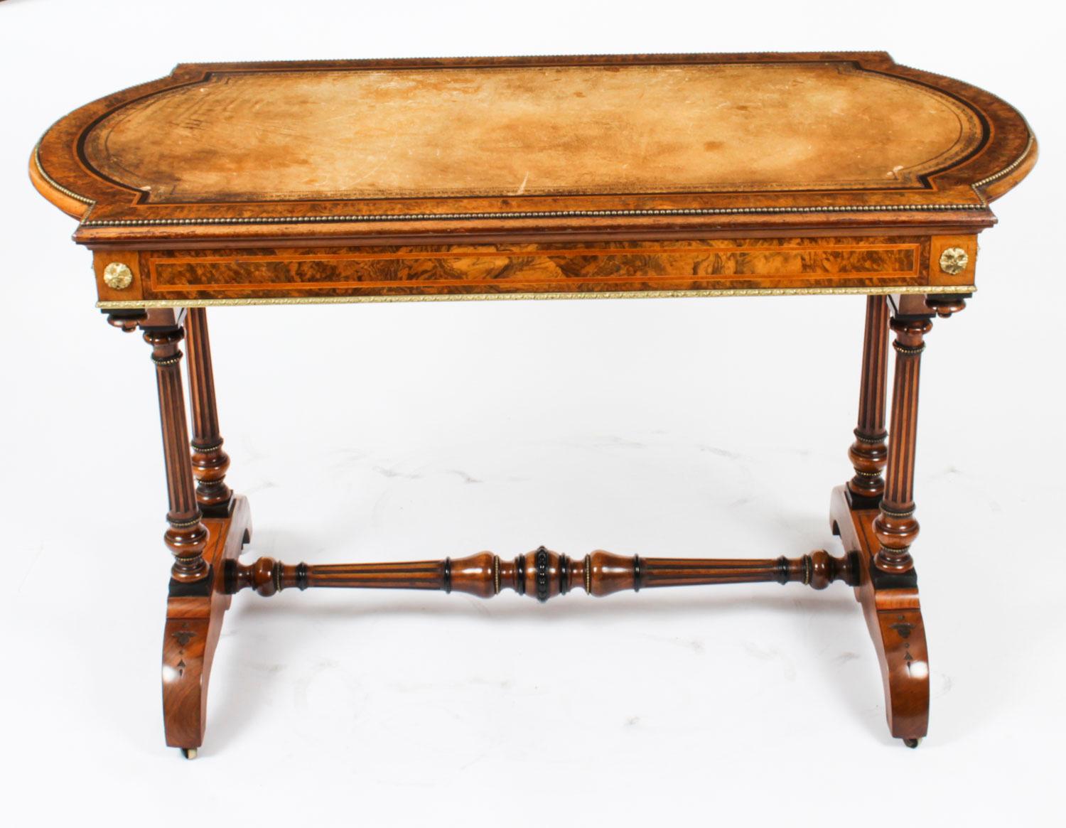 This is an elegant antique Victorian ormolu mounted burr walnut writing table attributed to the renowned cabinet makers Holland & Sons, Circa 1870 in date.

This gorgeous desk is crafted from the most beautiful burr walnut inlaid with crossbanded