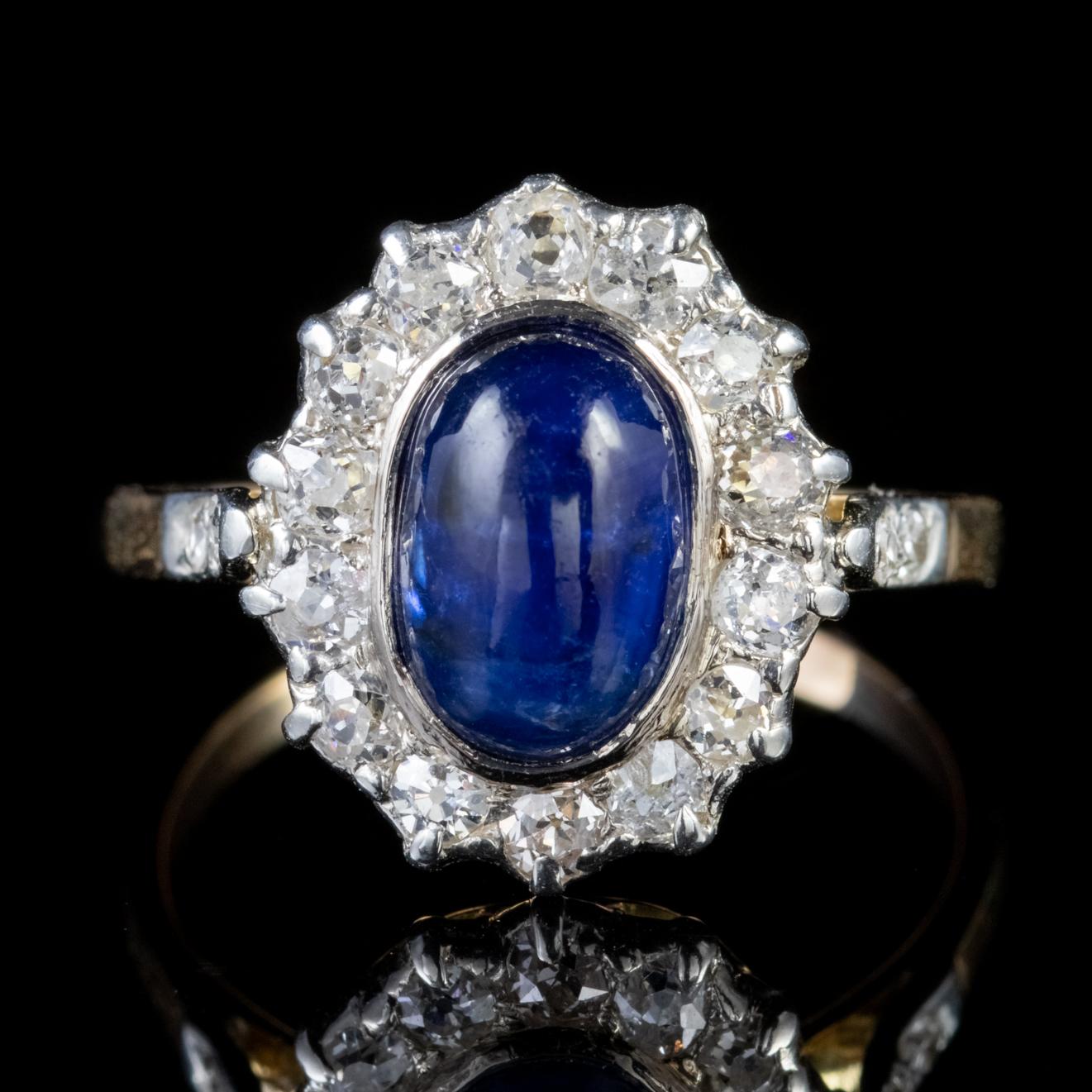 A beautiful Antique Victorian cluster ring crowned with a stunning cabochon cut Sapphire which is approx. 1.65ct and haloed by stunning old European cut Diamonds which are around 0.05ct each, 1ct in total. 

The Diamonds are beautiful, bright SI1