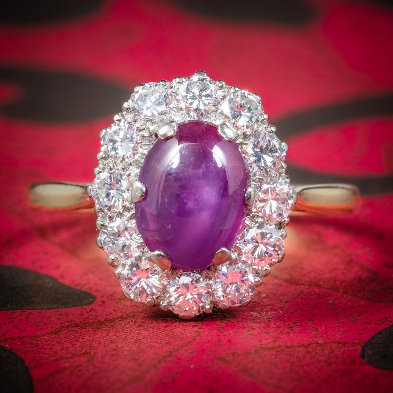This magnificent antique star Ruby and Diamond ring is Victorian, Circa 1900. 

Set with a 1.80ct Natural pink cabochon cut Ruby that features a mystifying star that shimmers across the Rubies surface in the light. 

The Ruby is surrounded by old