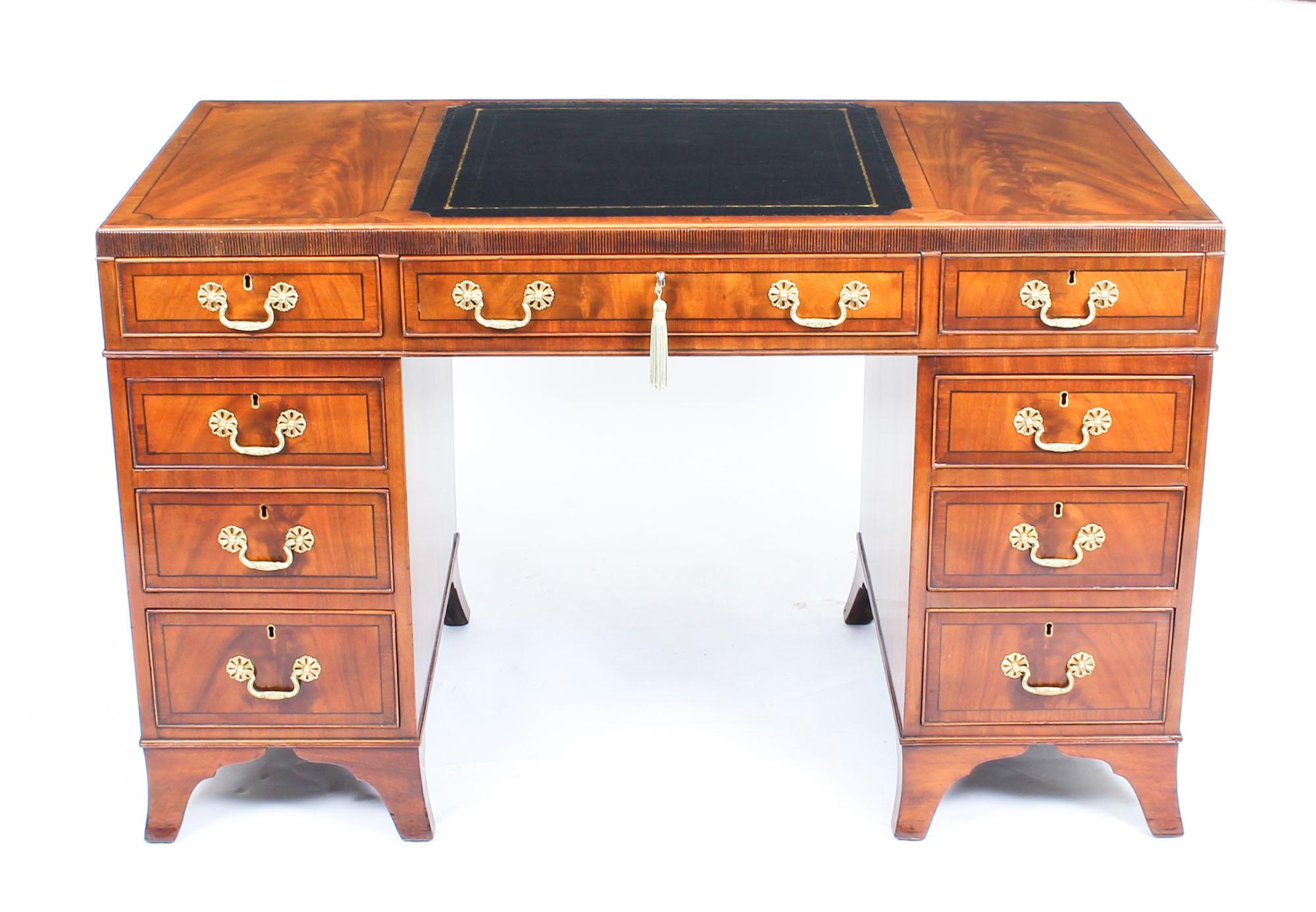 This is a fine antique late Victorian mahogany caddy top pedestal desk, circa 1880 in date.
 
This desk is made from beautiful flame mahogany with ebonized stringing and crossbanding. It features a stunning gilt tooled black leather writing