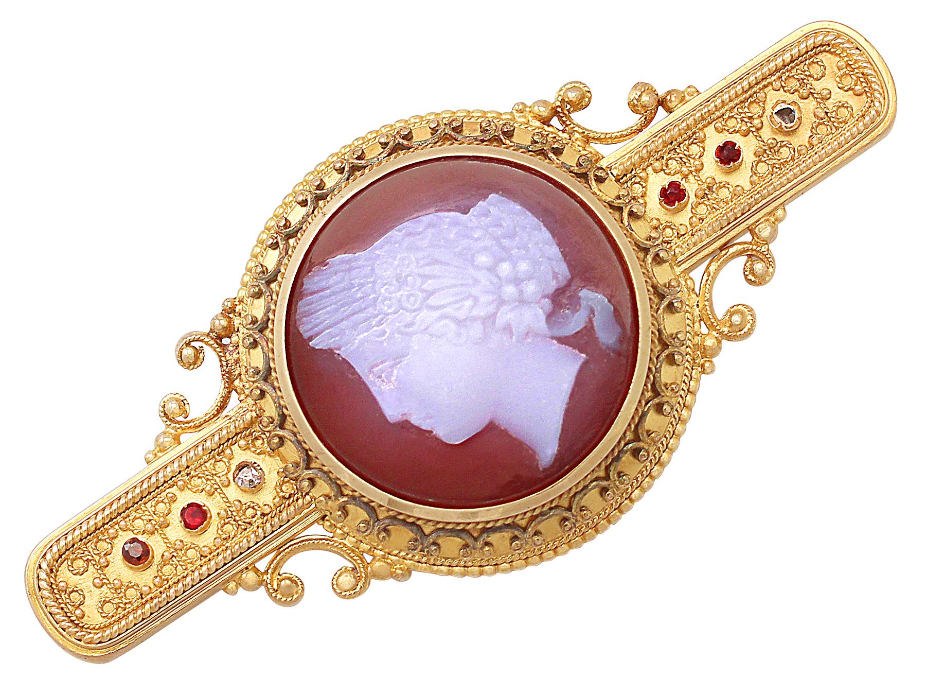 A fine and impressive antique Victorian cameo brooch/locket, in 14 karat yellow gold; part of our antique jewelry and estate jewelry collections.

This fine antique cameo brooch has been crafted in 14k yellow gold with a hardstone cameo.

The