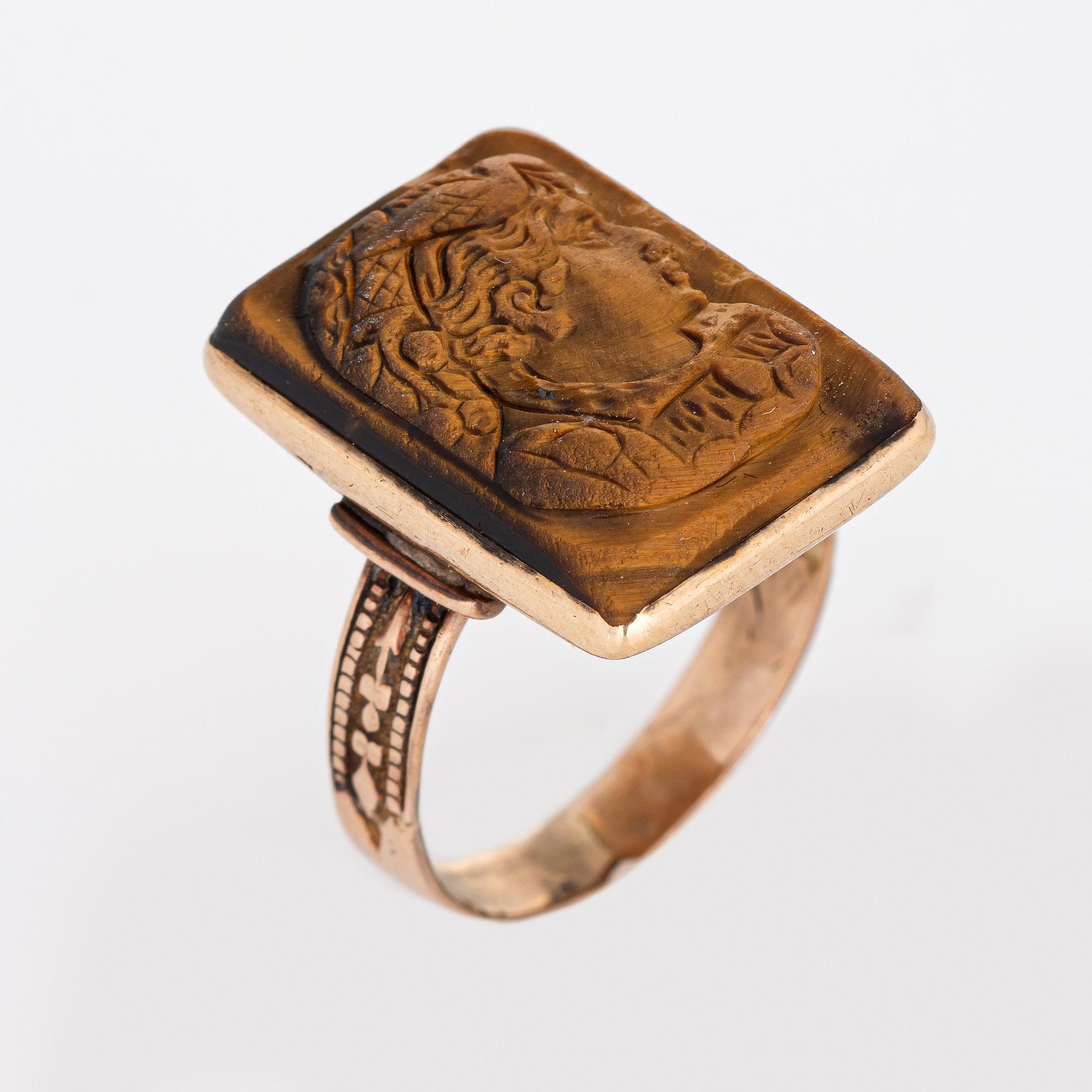 Stylish antique Victorian tigers eye cameo ring (circa 1880s to 1900s) crafted in 10 karat yellow gold. 

Tigers eye measures 18mm x 12mm. The stone is in good condition with light wear evident under a 10x loupe. 

The side profile of a solider is