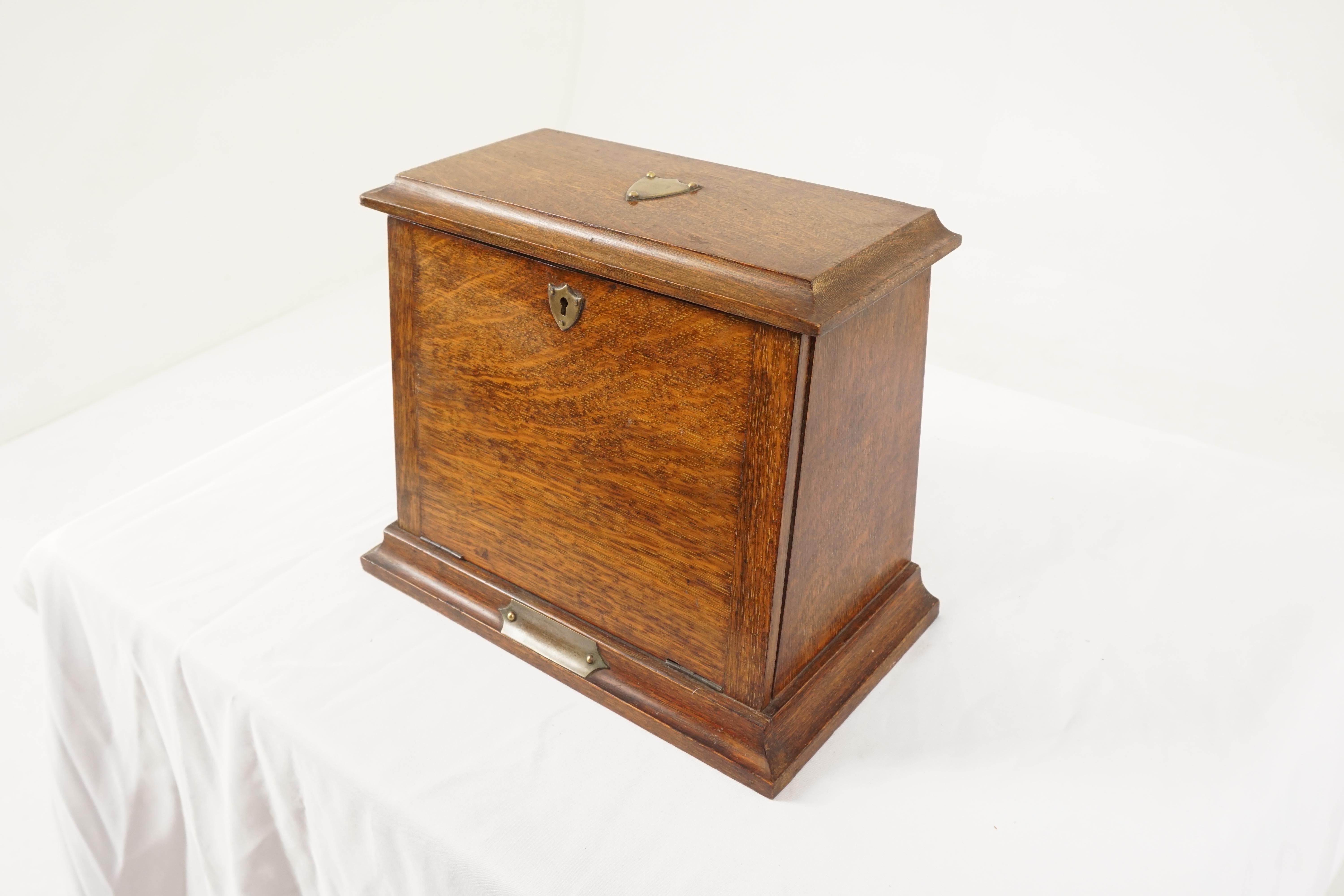 Antique Victorian Campaign stationary box, fall front, Scotland 1890, B2150y

Scotland 1890
Solid oak
Original finish
Hinged top that opens up
The box has a slanted front that opens to opens to reveal a slanted writing surface
Three shaped