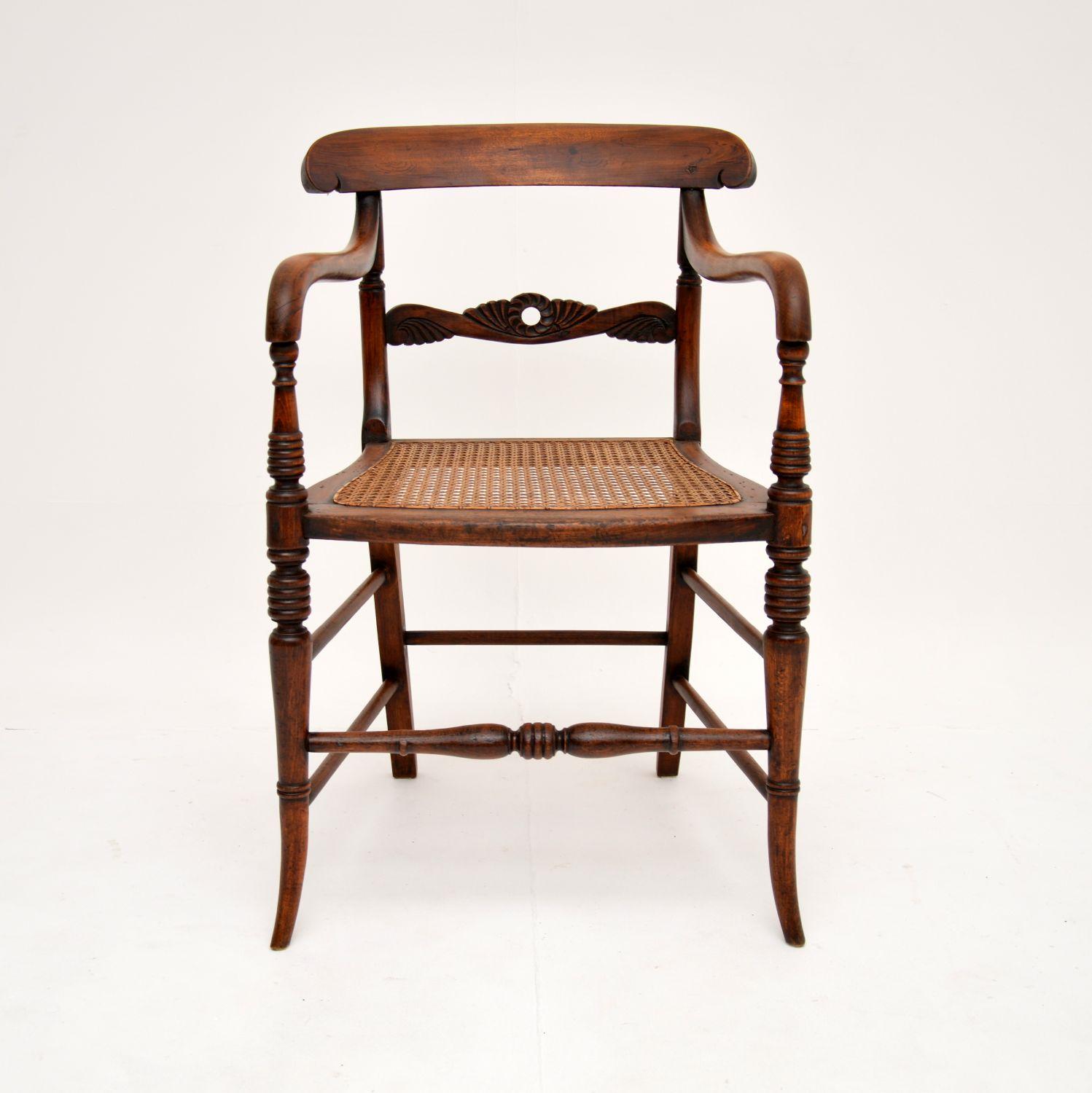 A gorgeous antique Victorian armchair in solid beech wood with a caned seat. This was made in England, it dates from around the 1860-1880 period.

It is of lovely proportions and is extremely well made. The arms sweep down beautifully and seamlessly