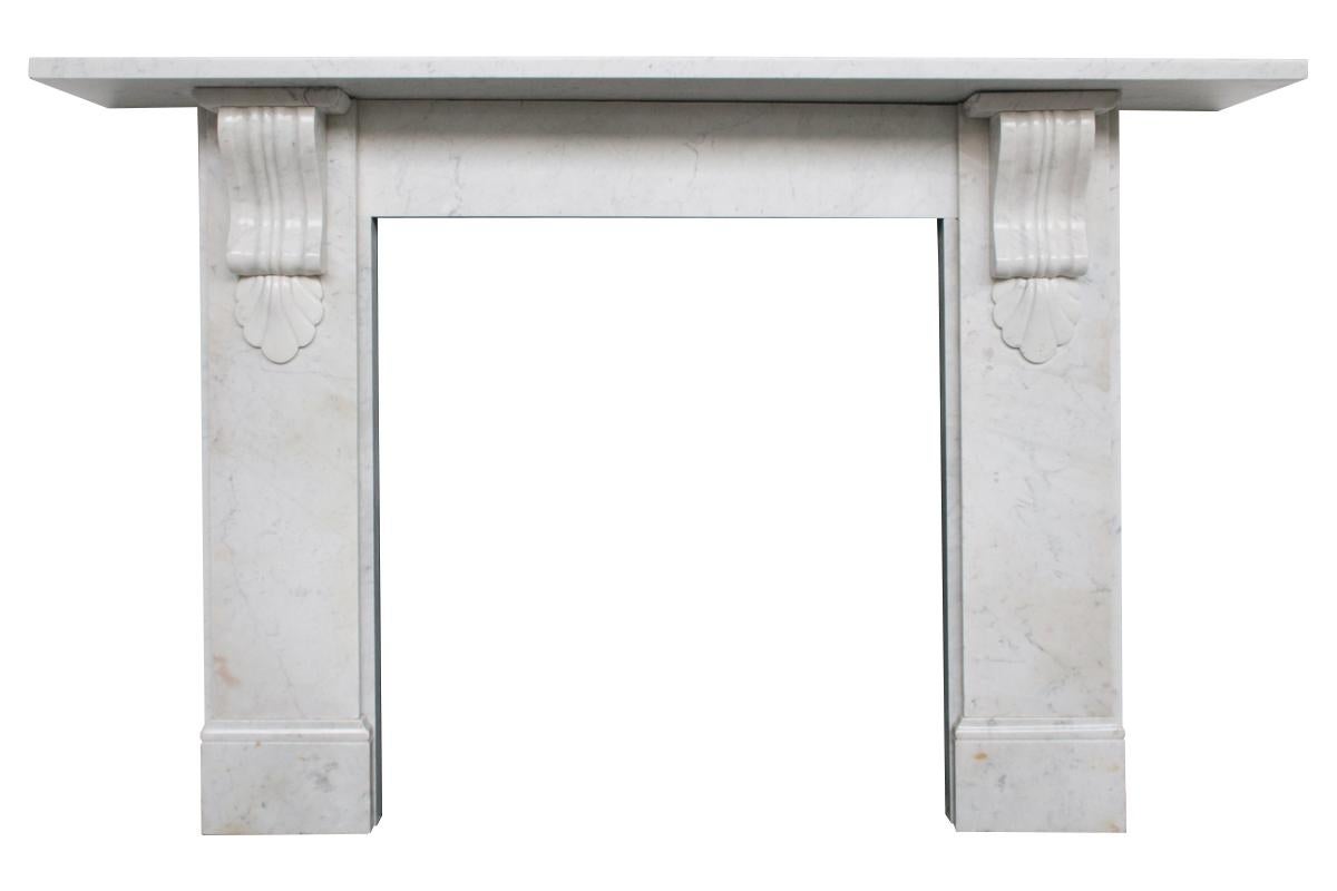 Antique Victorian Carrara marble fireplace surround with fluted corbels supporting a generous shelf, circa 1880. The shelf can be reduced in width if required. For detailed sizes please see the size diagram in the image gallery.

         