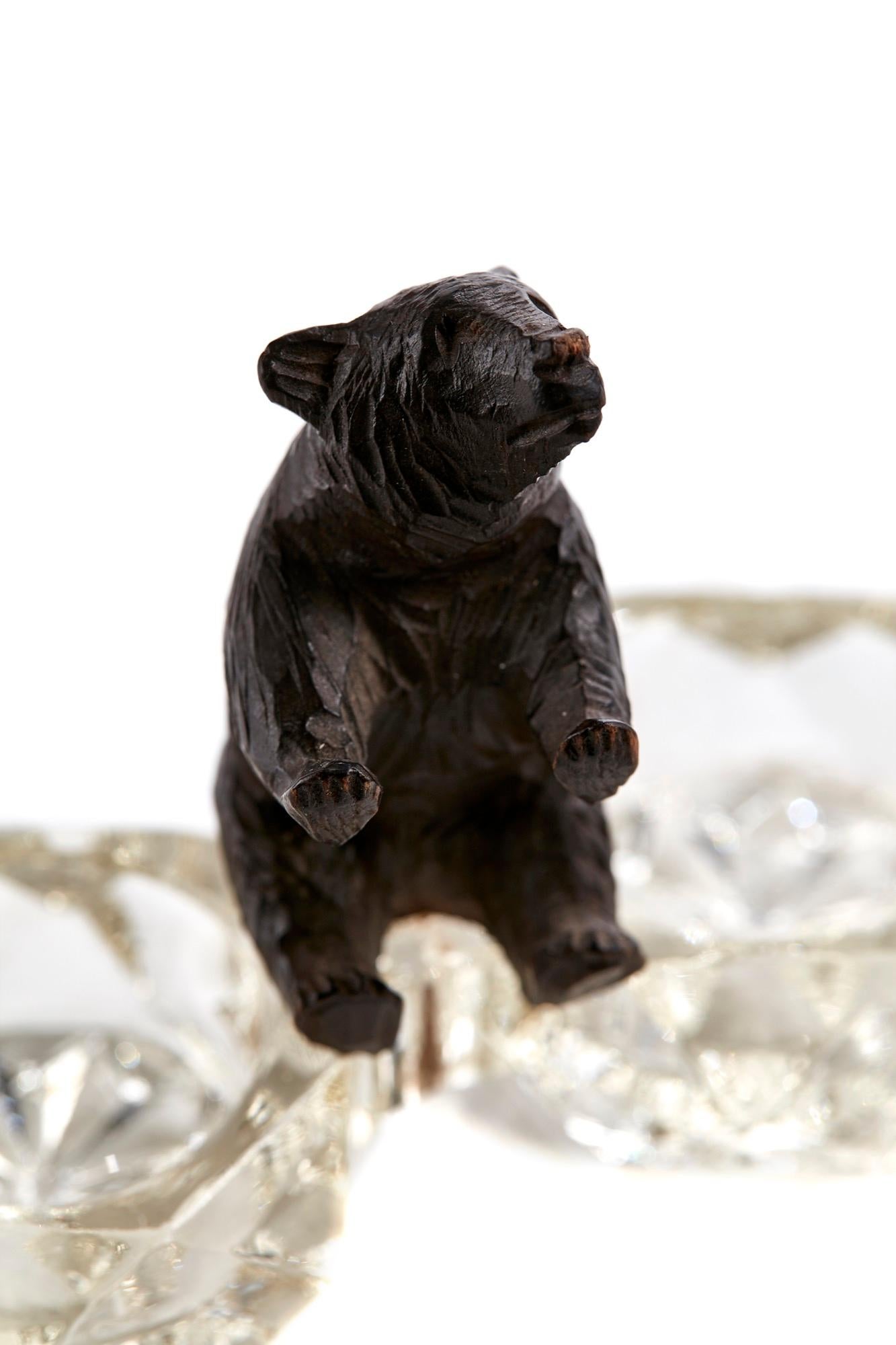 Unusual well carved antique Victorian Black Forest bear sitting on top of two cut glass table salts.

In lovely original condition.

Measures: H 7 cm
W 10 cm
D 4cm

Date 1880.
 
