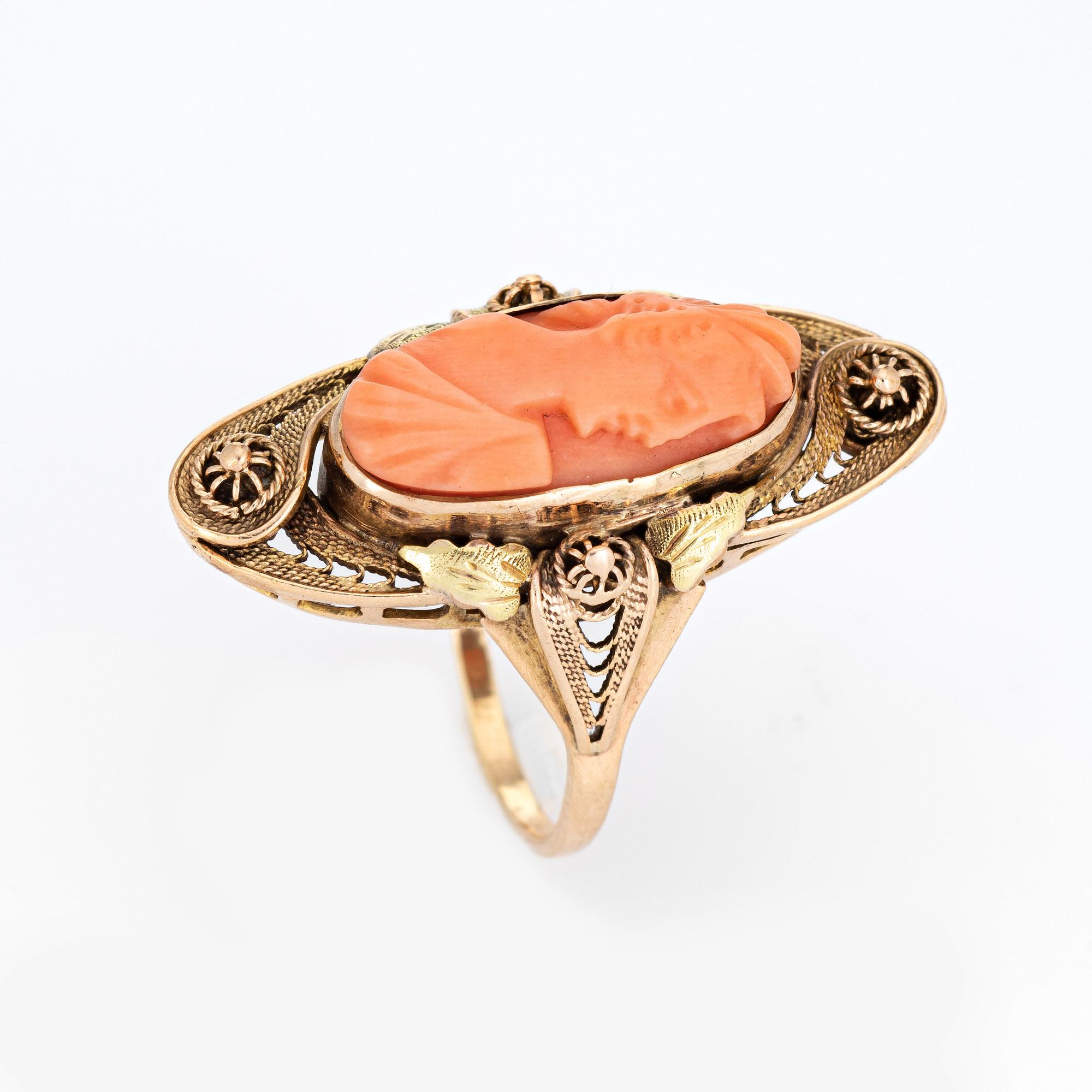Finely detailed antique Victorian carved cameo ring (circa 1880s to 1900s) crafted in 10 karat yellow gold. 

Natural carved coral measures 16mm x 8mm. The coral is in good condition (free of cracks or chips yet showing some wear). 

The coral cameo
