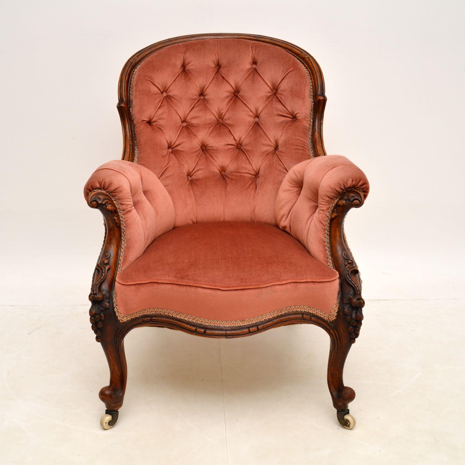 A stunning and extremely well made antique Victorian armchair in mahogany. This was made in England, it dates from around the 1850-1870 period.

The quality is outstanding, with wonderful deep carving all over, including grape vines on the front