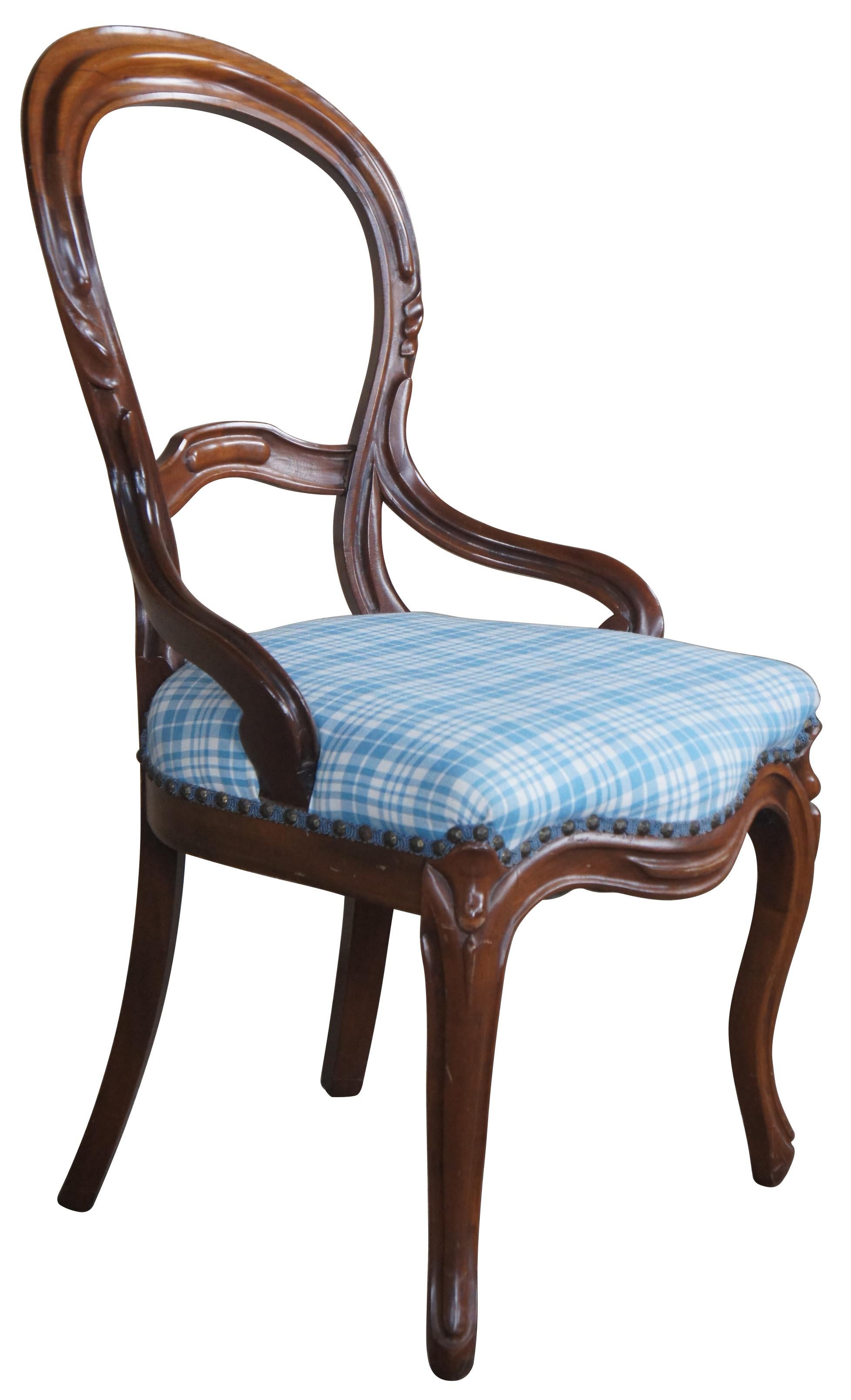 Late Victorian era mahogany balloon back side chair. Features a nicely shaped back with carved accents leading to scrolled arms and a plaid seat with nailhead trim.
 