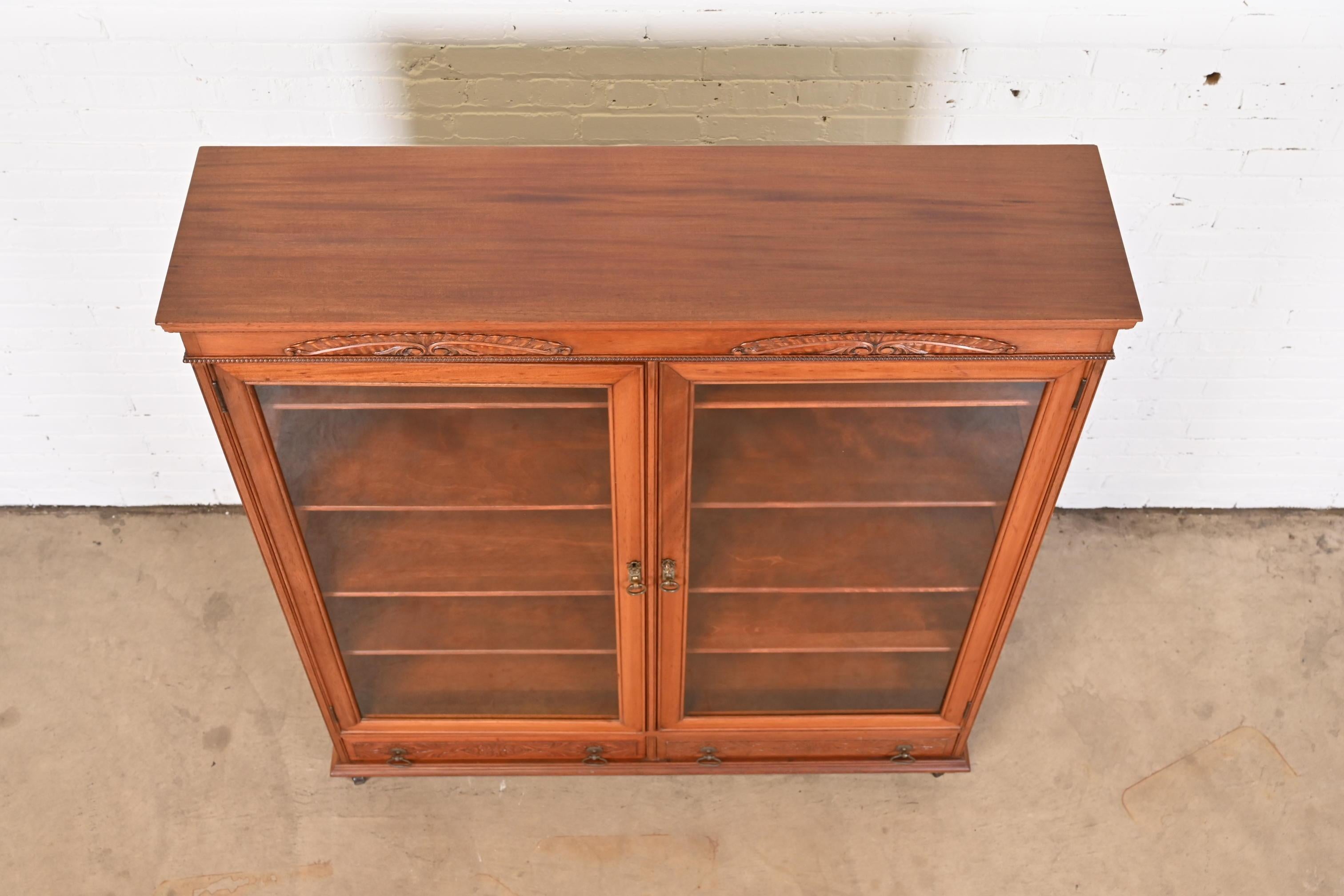 Brass Antique Victorian Carved Mahogany Glass Front Double Bookcase, Circa 1900