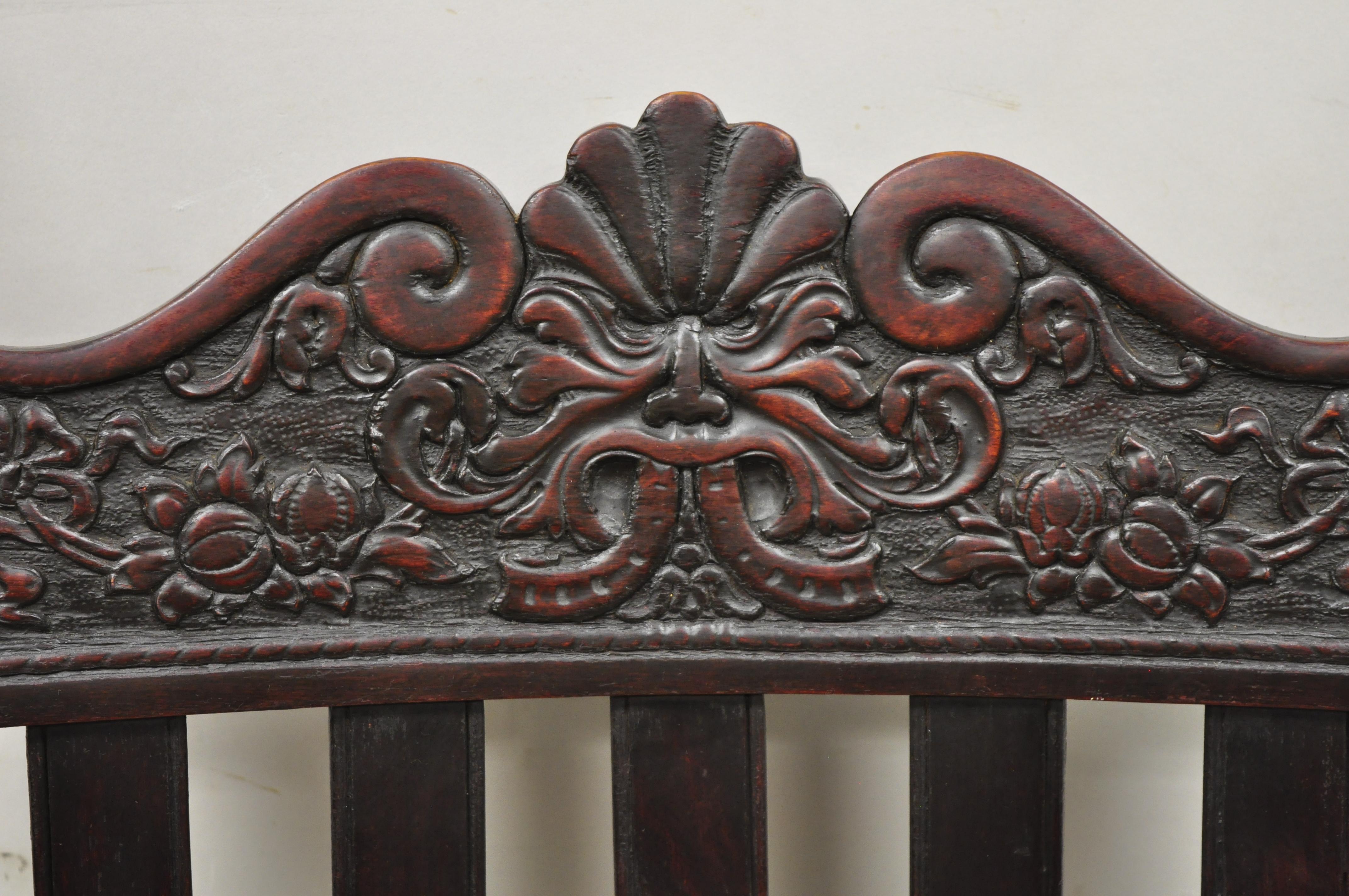 antique rocking chair with carved face