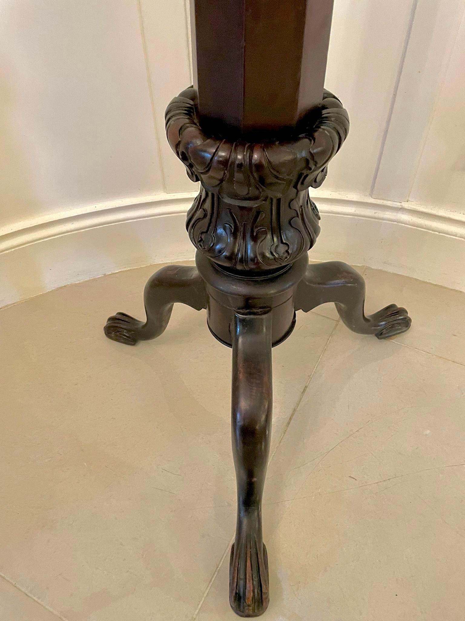 Antique Victorian carved mahogany torchere having a quality mahogany circular top supported by a octagonal shaped quality carved mahogany column raised on shaped cabriole legs with carved claw feet.

An attractive example in lovely original