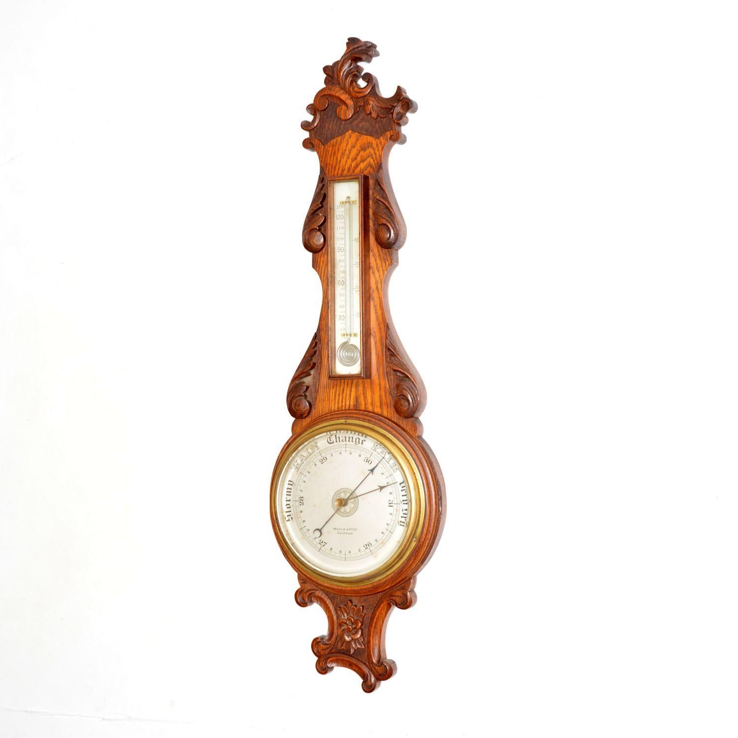 A wonderful antique Victorian banjo barometer in carved solid oak. This was made in London by Maple and Co, it dates from around the 1860-1880 period.

It is of amazing quality, beautifully designed and it appears to be in excellent condition for