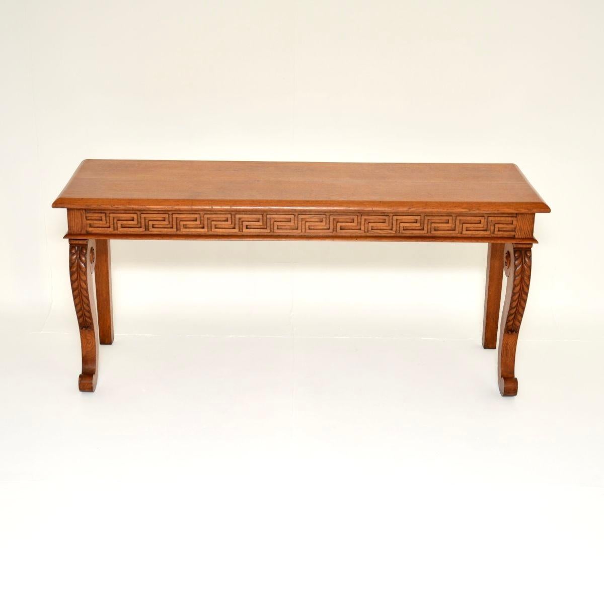 A large and very impressive antique Victorian carved oak console table. This was made in England, it dates from around the 1840-1860 period.

It is of extremely fine quality, with a beautiful design. The frieze is wonderfully carved with a Greek key