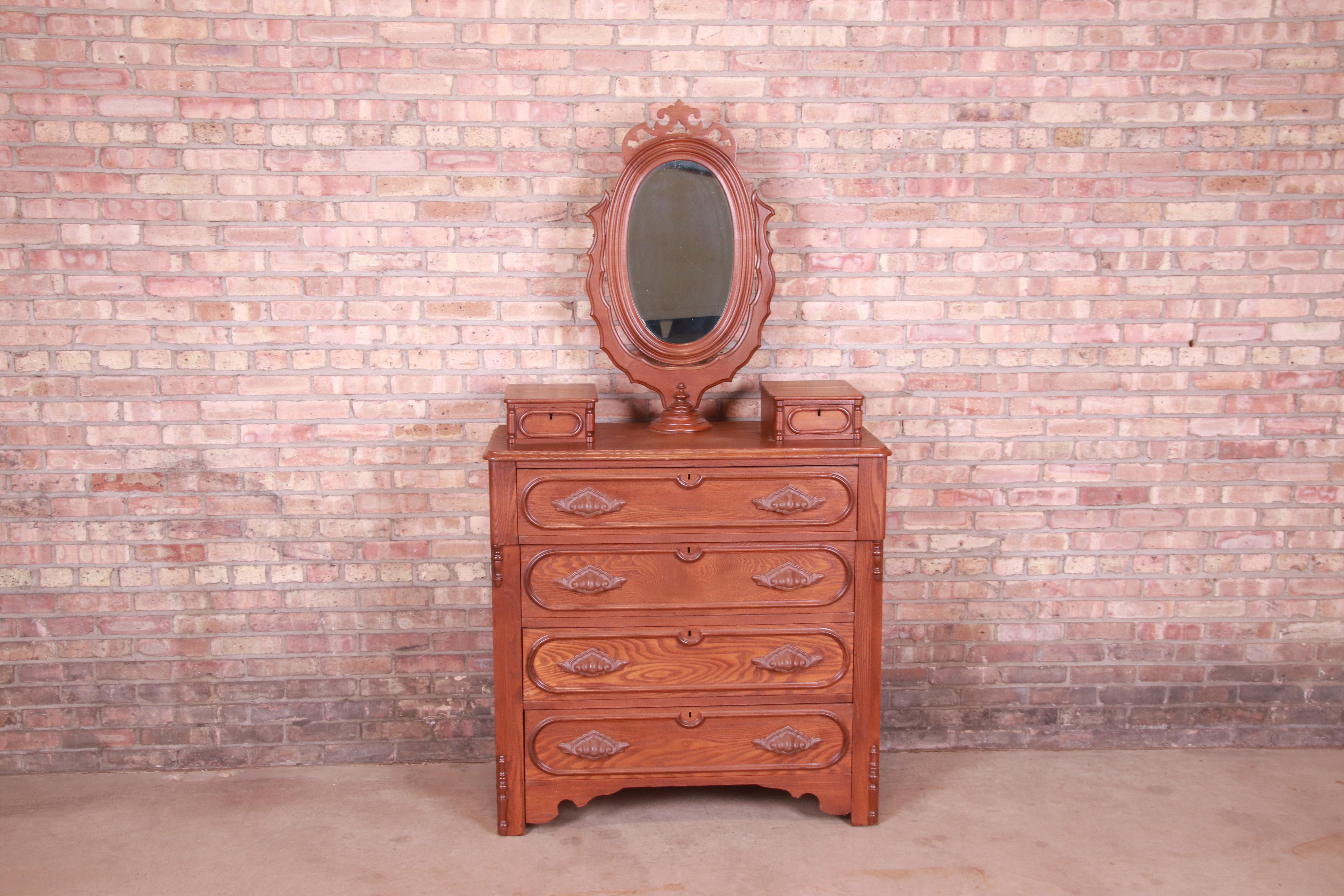 A gorgeous antique Victorian carved oak dresser with mirror

USA, Circa 1880s

Measures: 41
