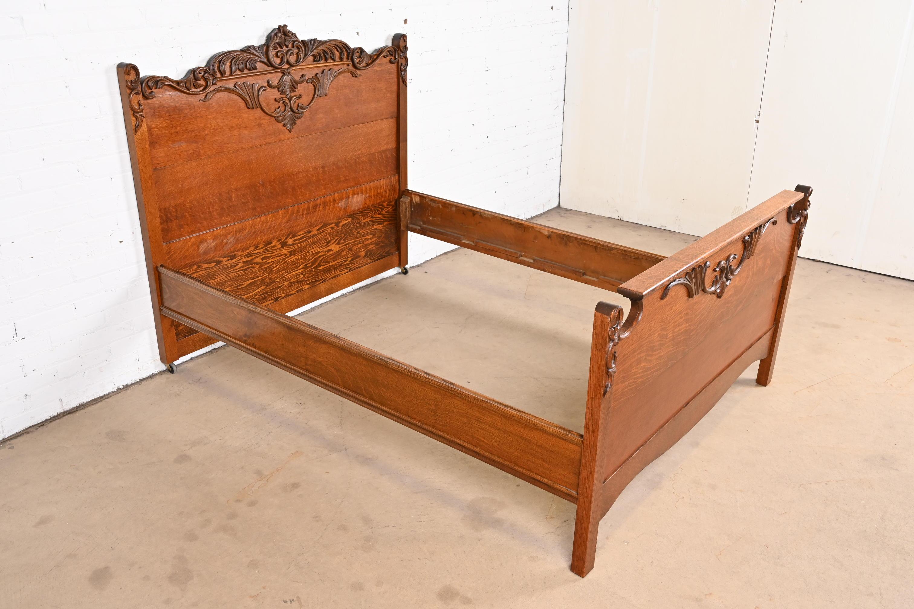 A gorgeous antique Victorian carved oak full size bed frame

USA, Circa 1890s

Measures: 56.5