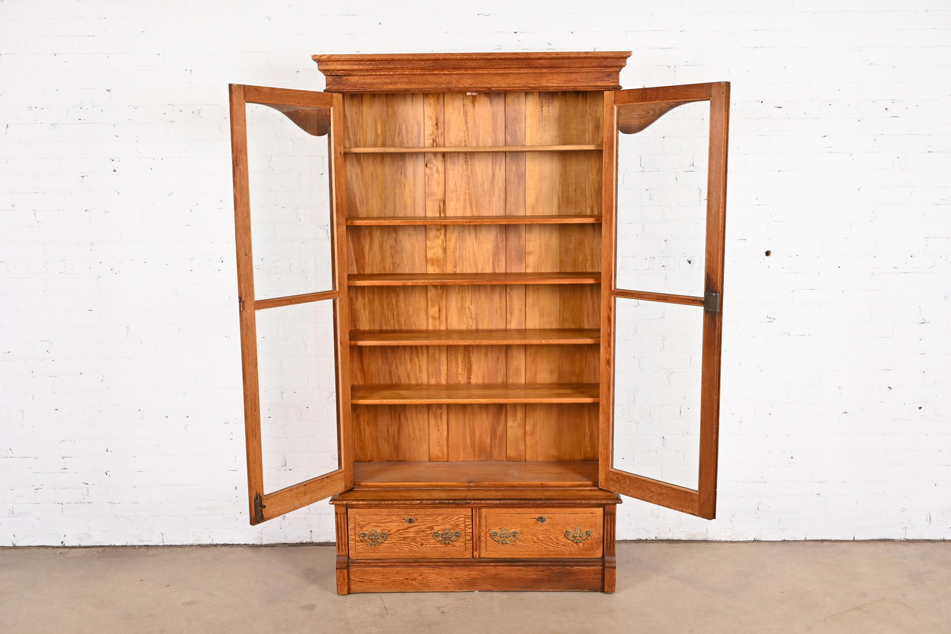 20th Century Antique Victorian Carved Oak Glass Front Bookcase, Circa 1900 For Sale