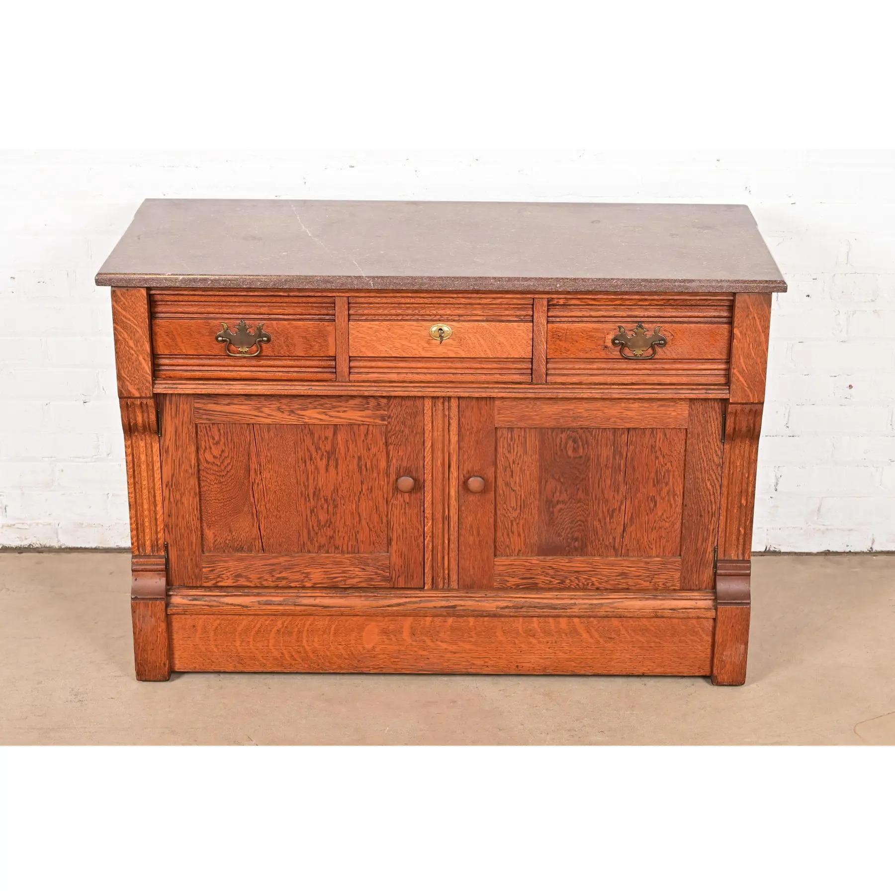 Antique Victorian Carved Oak Marble Top Sideboard Buffet or Bar Cabinet In Good Condition For Sale In South Bend, IN