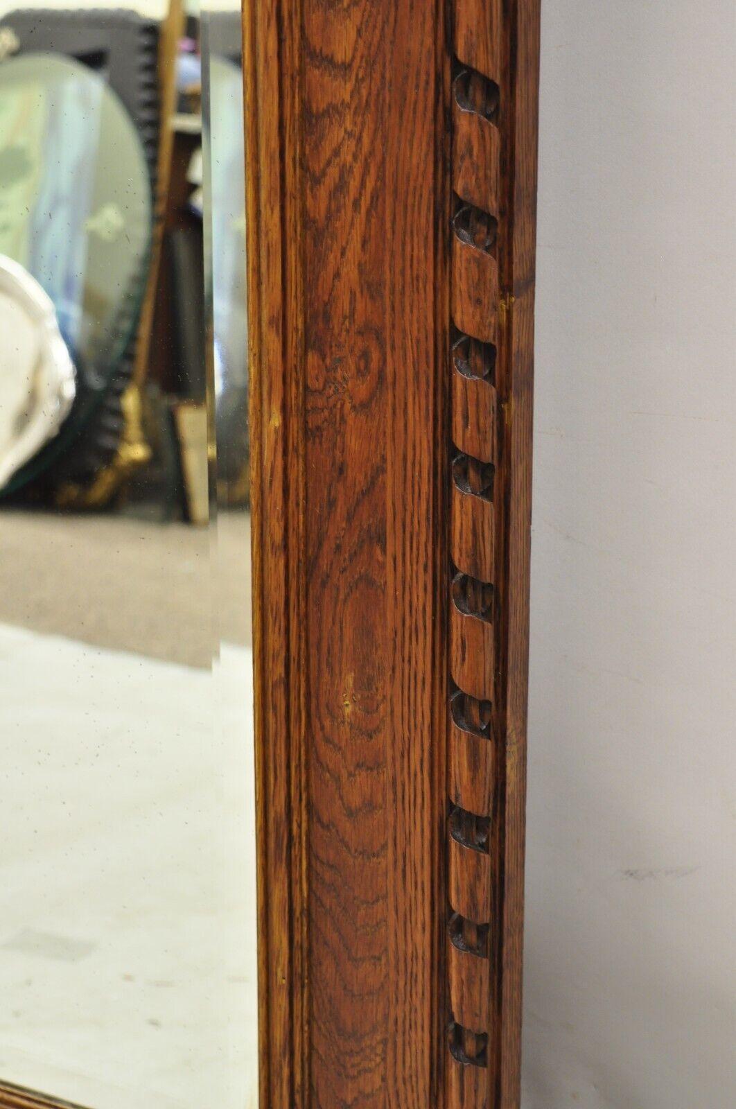 Antique Victorian Carved Oak Wood Ribbon Crest Beveled Glass Wall Mirror In Good Condition For Sale In Philadelphia, PA