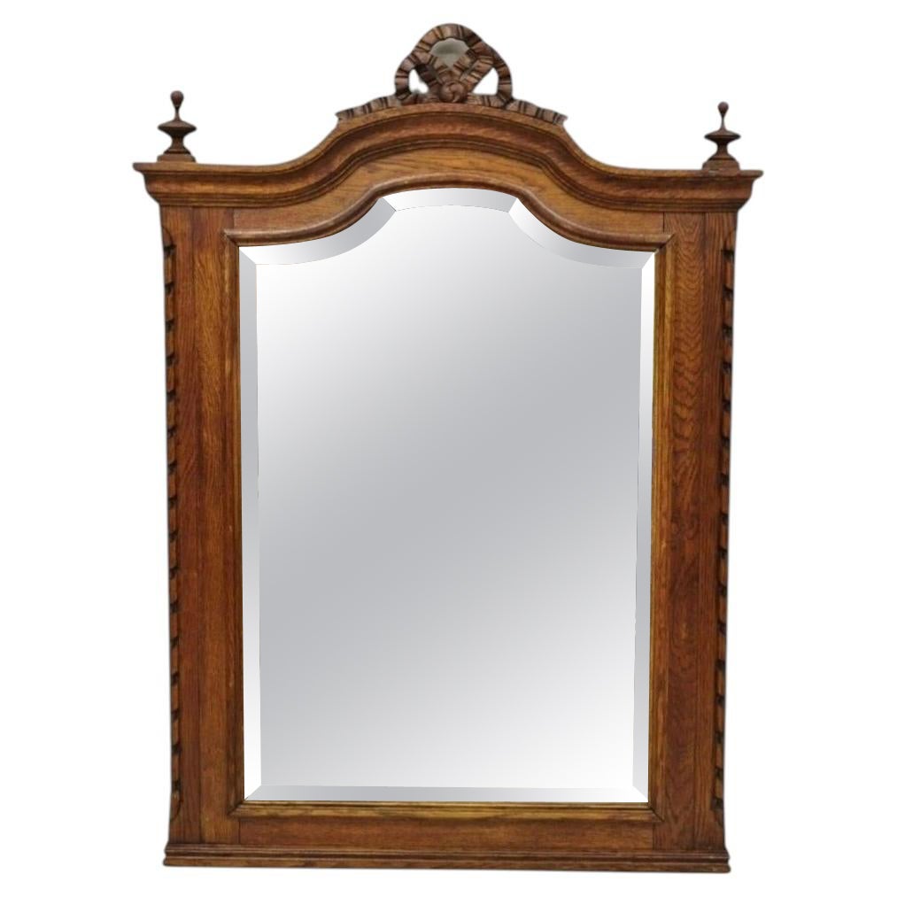 Antique Victorian Carved Oak Wood Ribbon Crest Beveled Glass Wall Mirror For Sale
