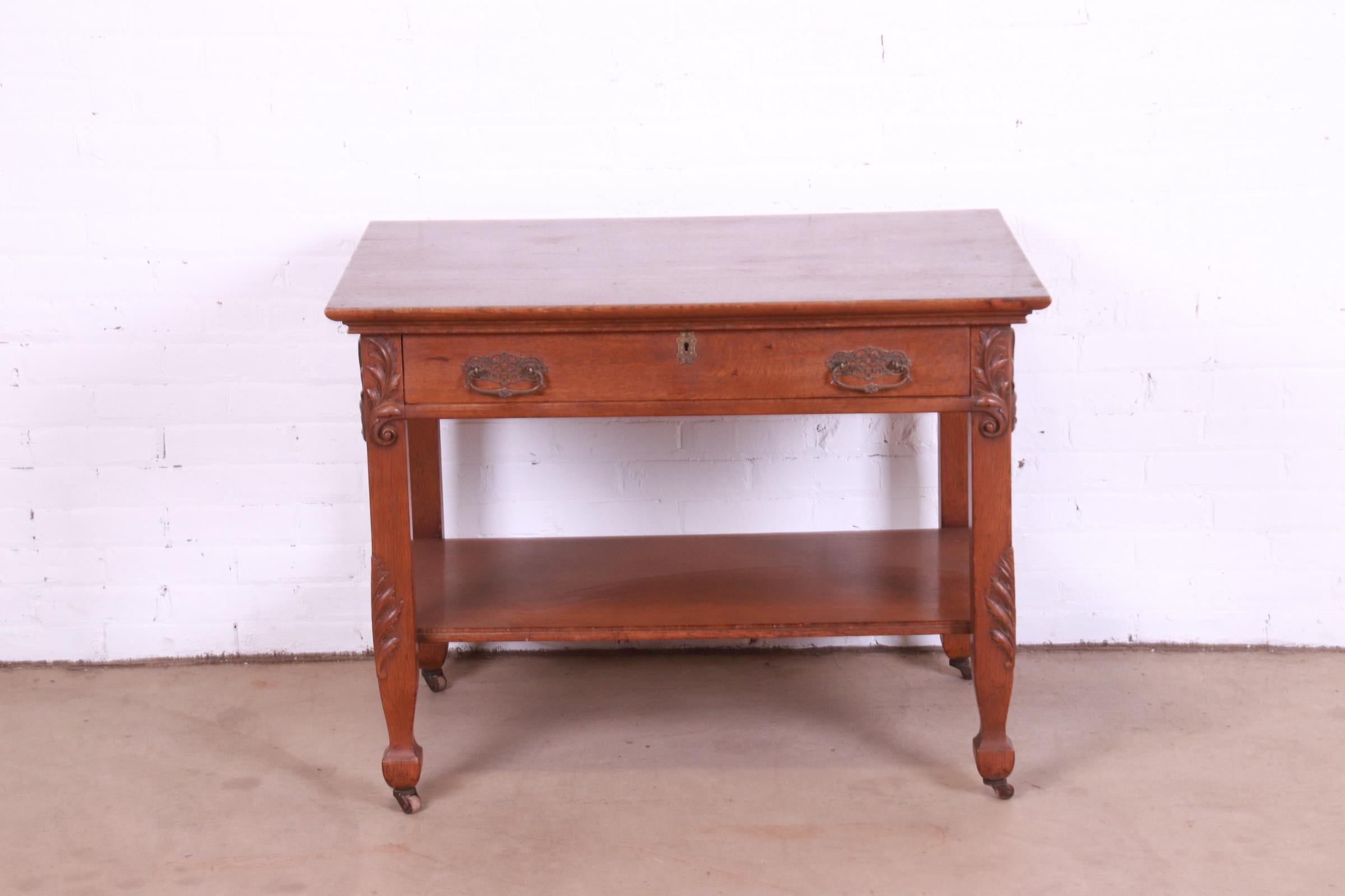 Late Victorian Antique Victorian Carved Oak Writing Desk or Library Table, Circa 1890s For Sale