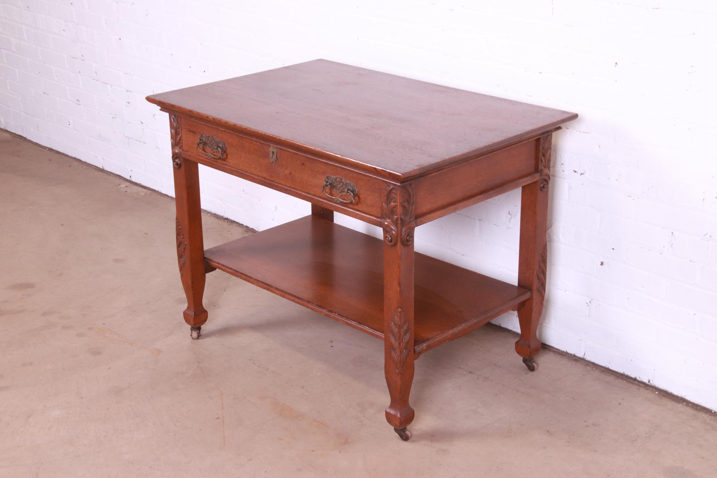 American Antique Victorian Carved Oak Writing Desk or Library Table, Circa 1890s For Sale