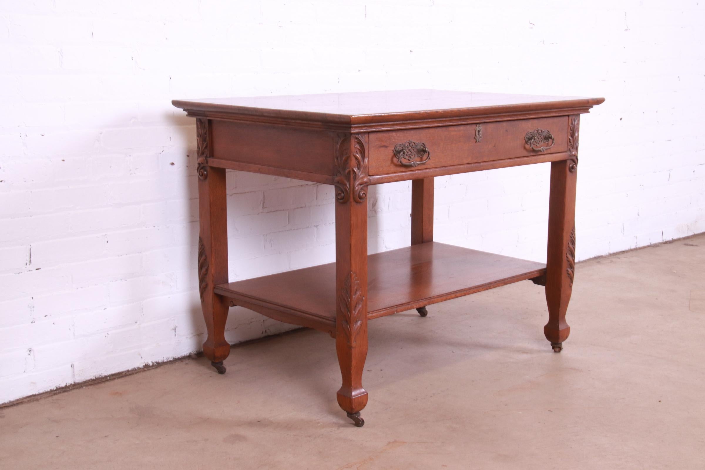 Brass Antique Victorian Carved Oak Writing Desk or Library Table, Circa 1890s For Sale