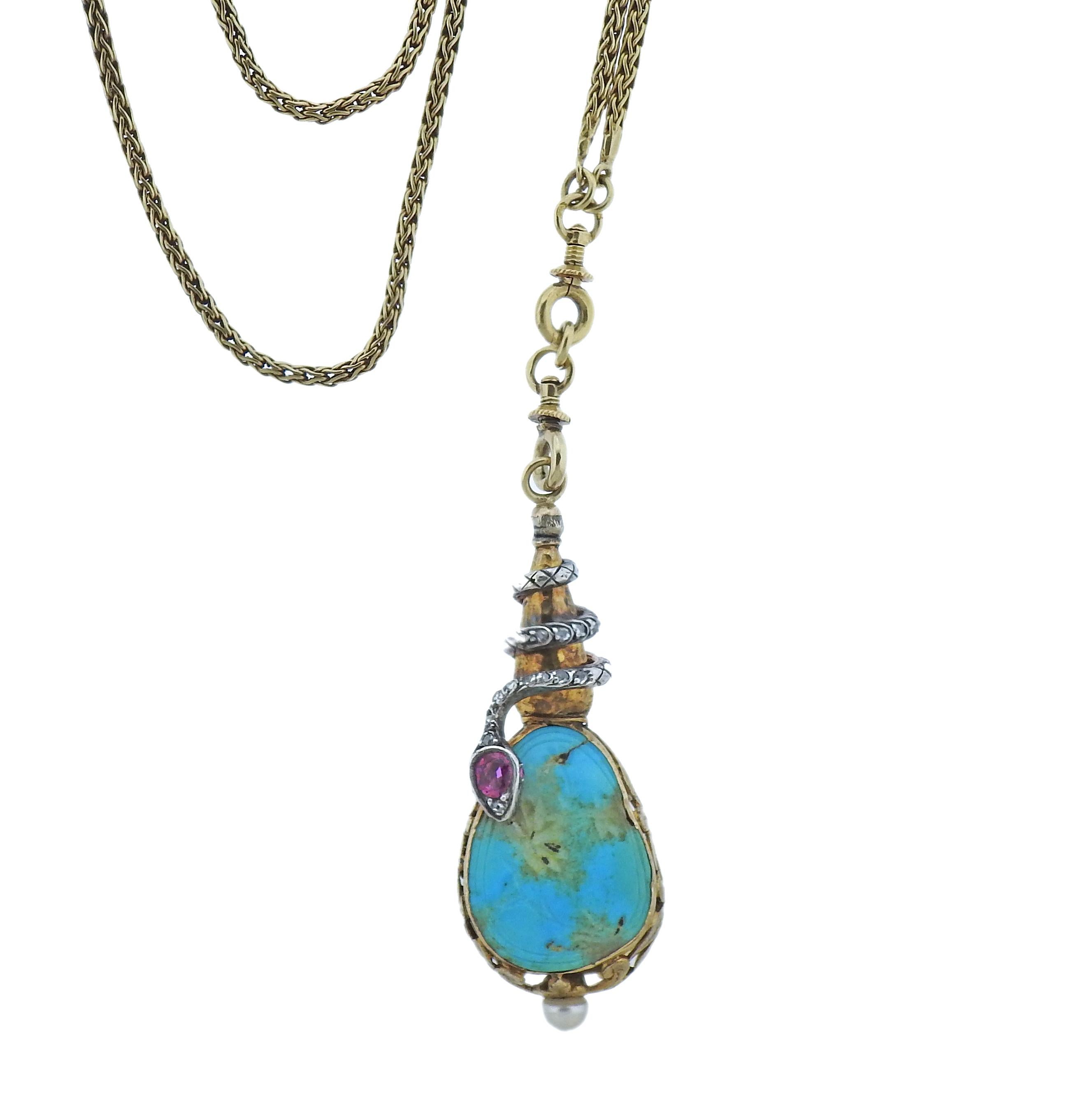 Antique 14k gold long fob chain, with attached pendant, featuring carved turquoise,  adorned with wrapped around snake design, set with ruby, rose cut diamonds. One pearl on the bottom of the pendant - 5mm. Necklace/chain is 62