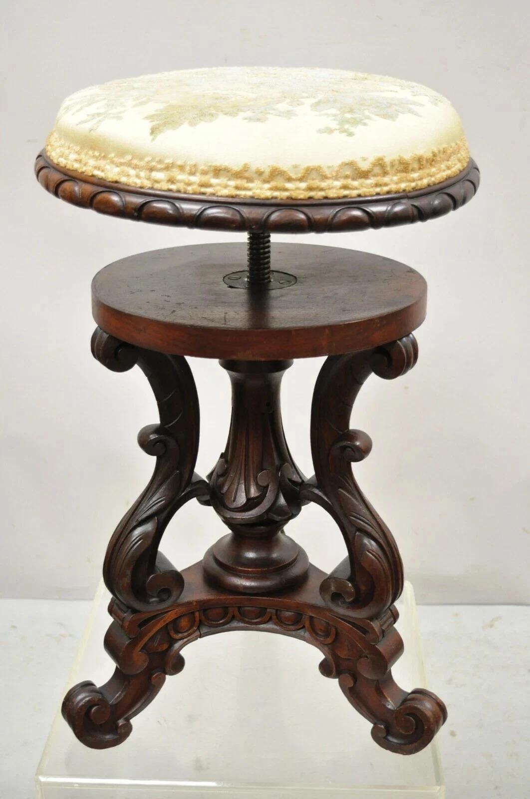 Antique Victorian Carved Walnut Adjustable Height Pedestal Base Piano Stool. Item features an adjustable height swivel seat, solid wood frame, nicely carved details, quality craftsmanship, great style and form. Circa Mid 19th Century. Measurements: