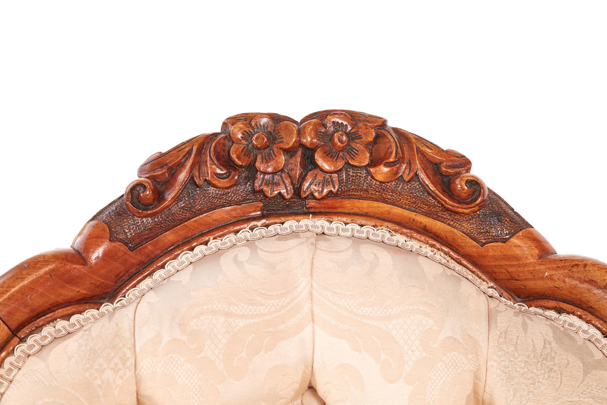 Antique Victorian carved walnut armchair with an elegantly carved detail to the top and a lovely shaped walnut back. It boasts carved open arms, carved front rail and stands on shaped carved cabriole legs to the front and outswept back