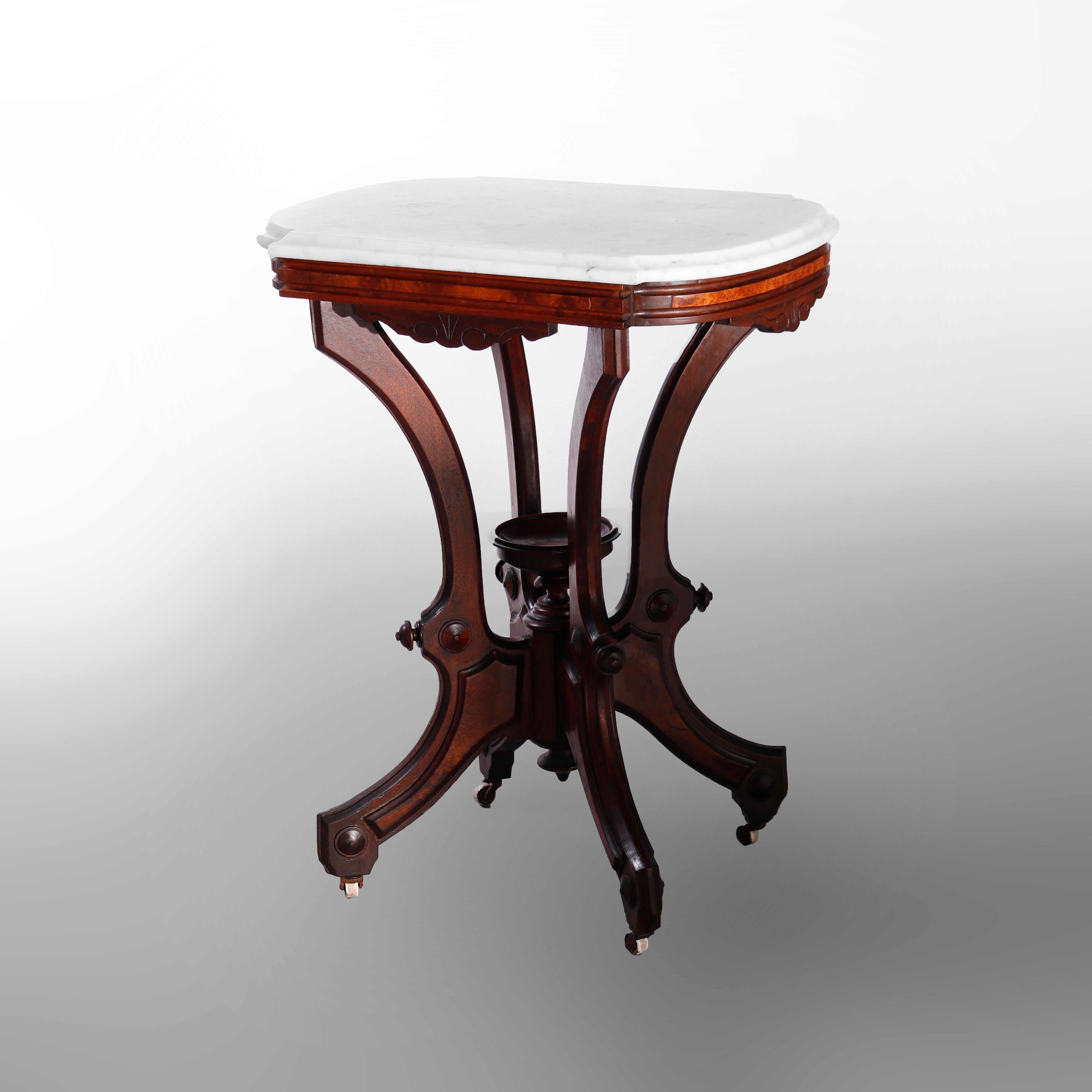 A Renaissance Revival parlor table offers shaped and beveled top over walnut and burl base raised on stylized scroll form legs with central urn form finial, c1890

Measures - 29.5''H x 23''W x 16.5''D.

Catalogue Note: Ask about DISCOUNTED DELIVERY