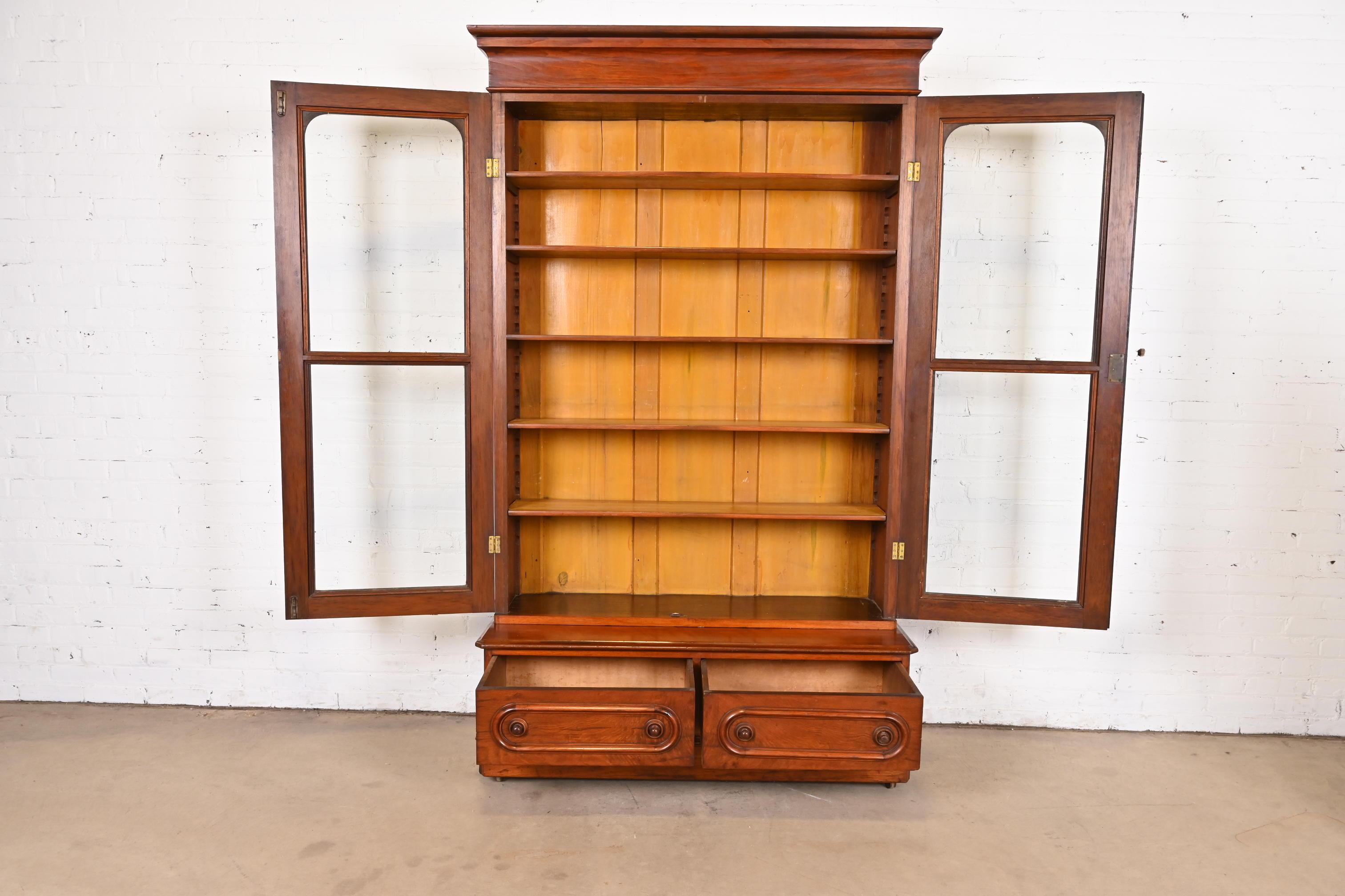 19th Century Antique Victorian Carved Walnut Glass Front Bookcase Cabinet, Circa 1880s For Sale