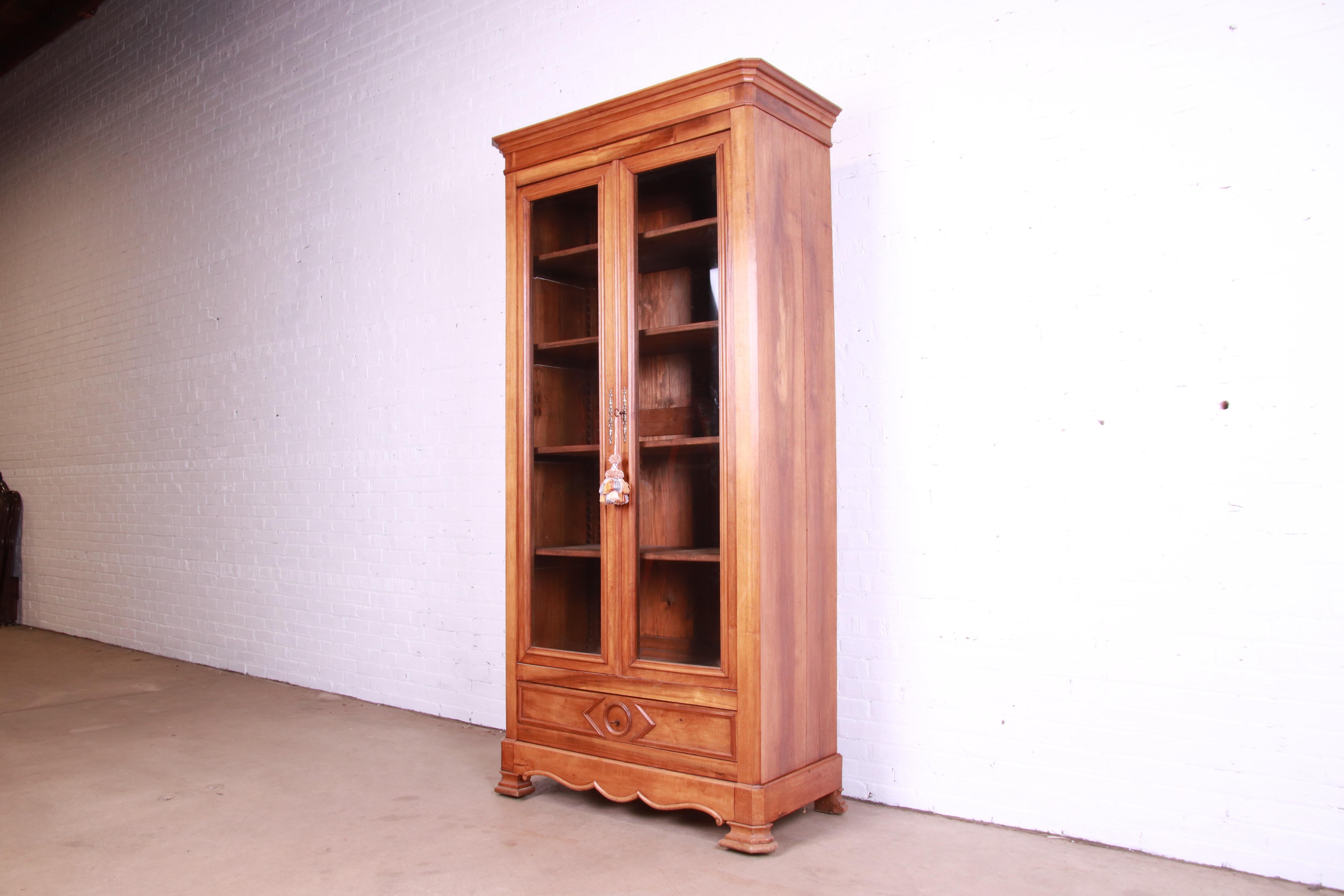 American Antique Victorian Carved Walnut Glass Front Bookcase, Circa 1890s For Sale