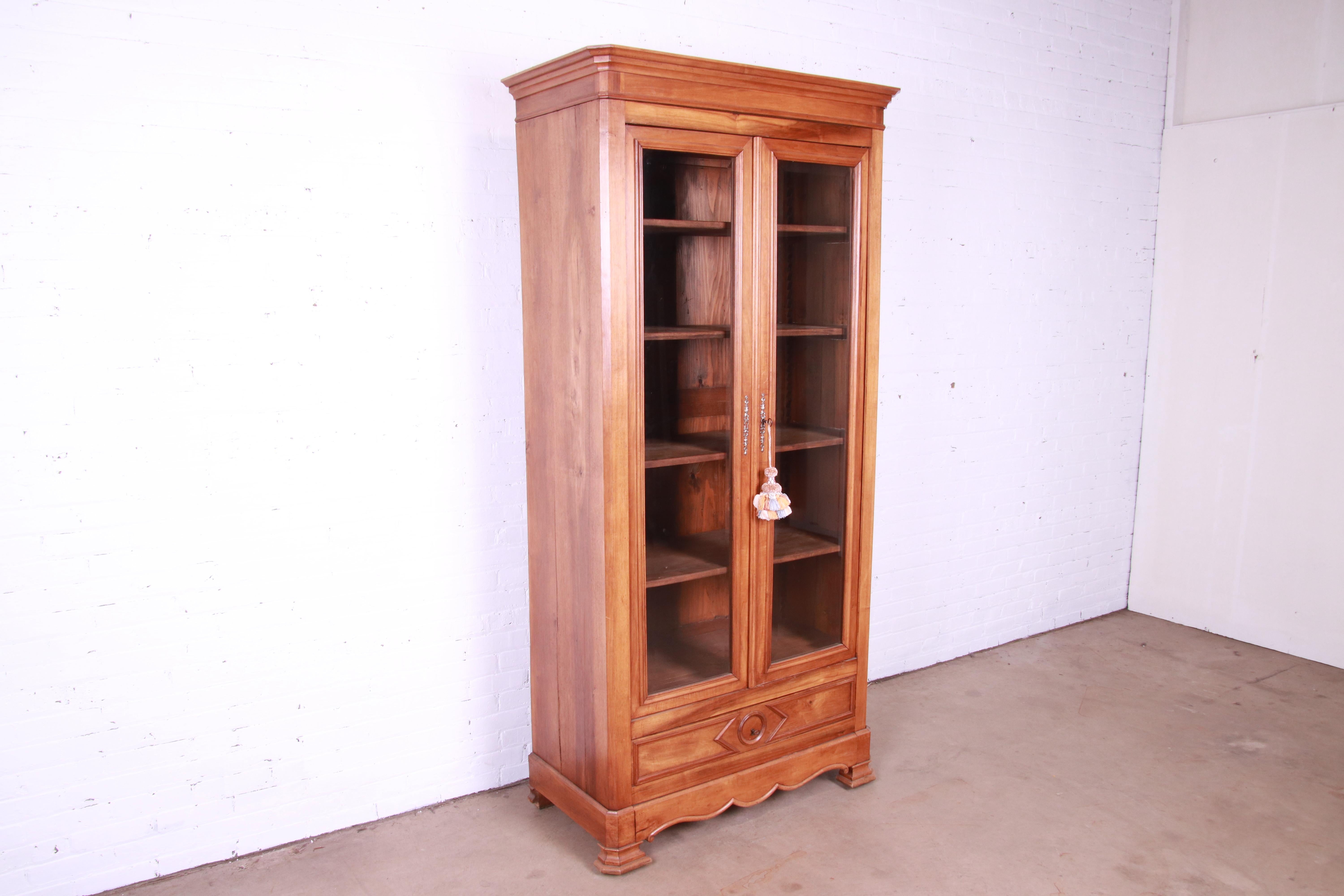 Antique Victorian Carved Walnut Glass Front Bookcase, Circa 1890s In Good Condition For Sale In South Bend, IN