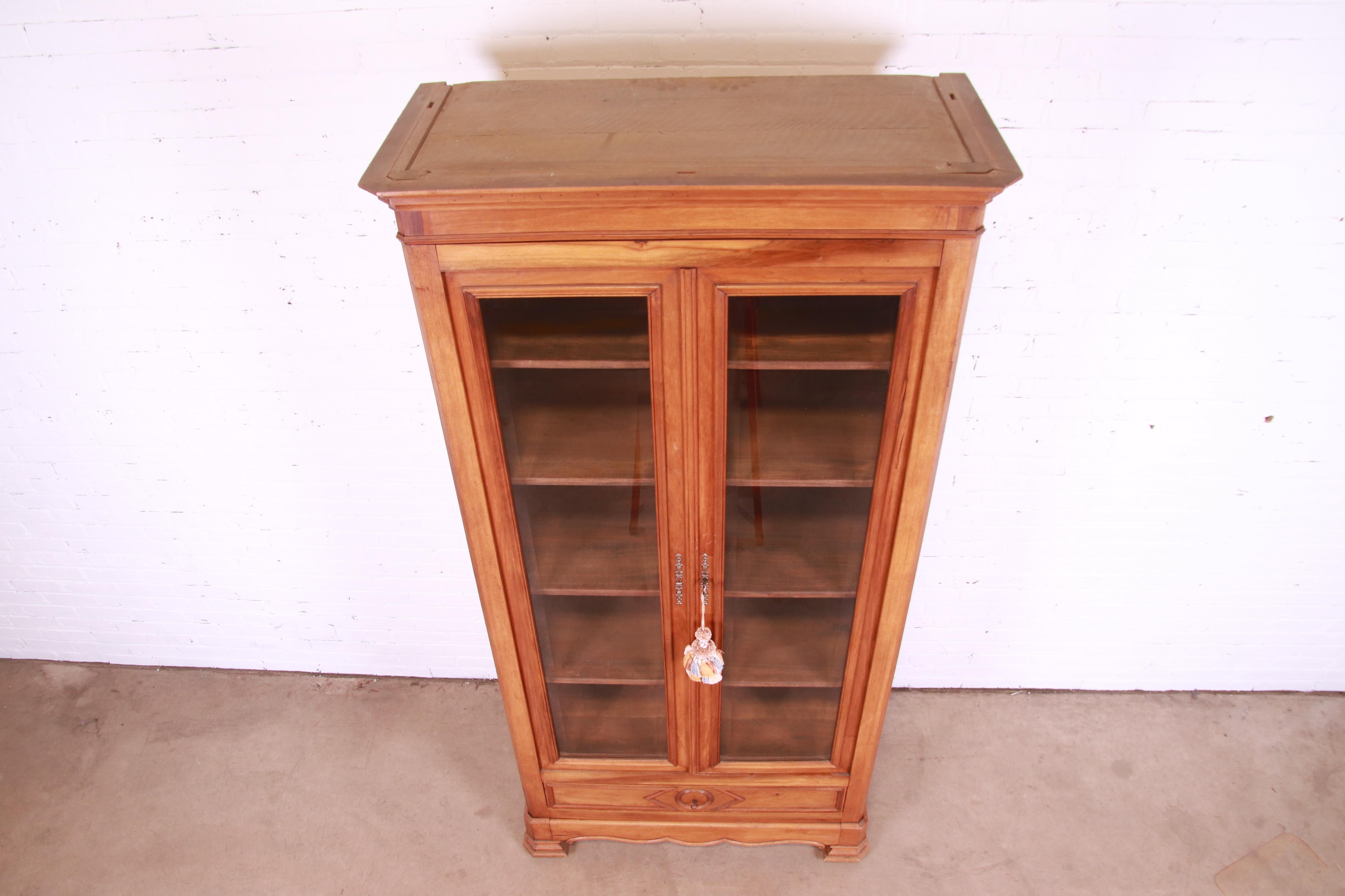 19th Century Antique Victorian Carved Walnut Glass Front Bookcase, Circa 1890s For Sale