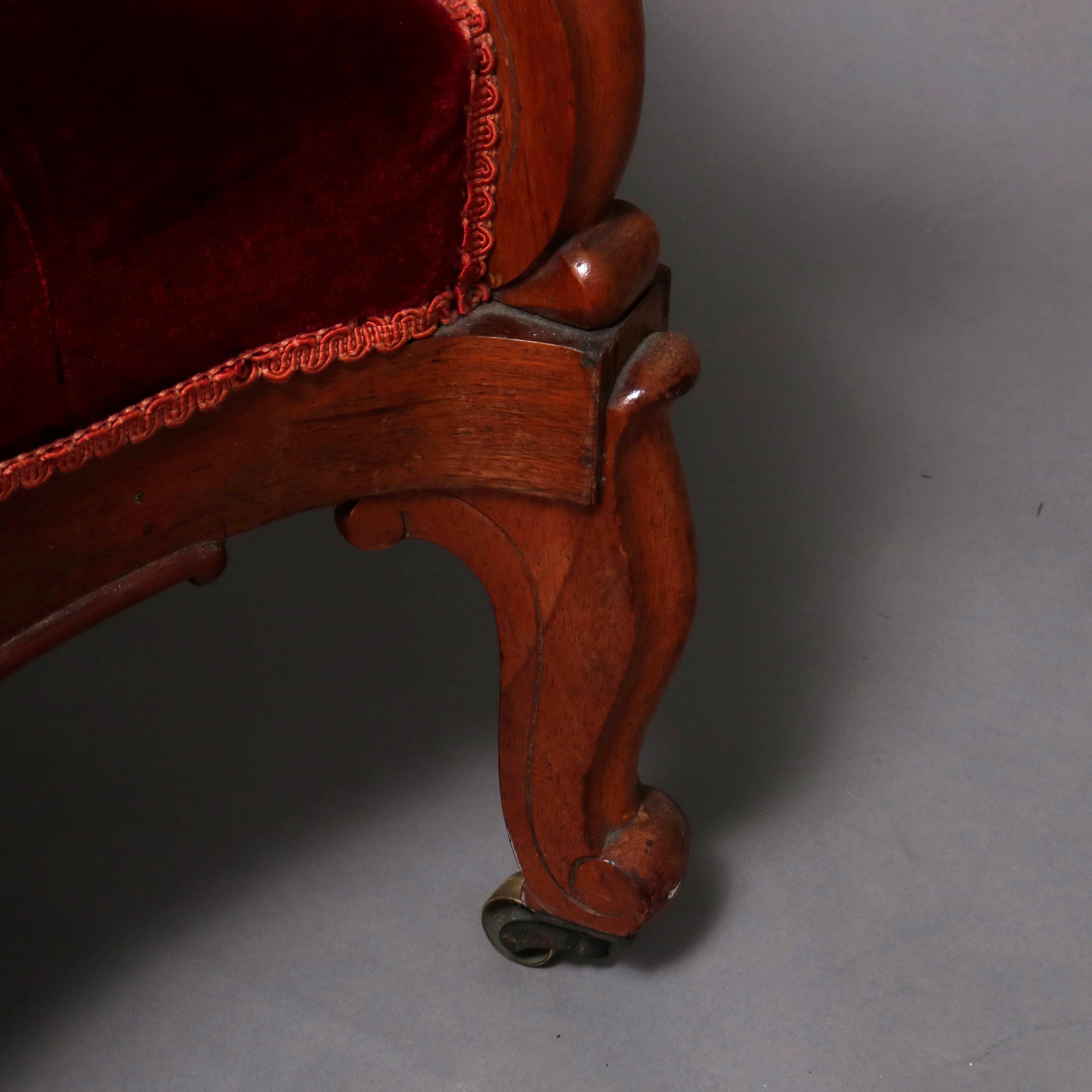 European Antique Victorian Carved Walnut and Plum Button Back Velvet Sofa, circa 1890