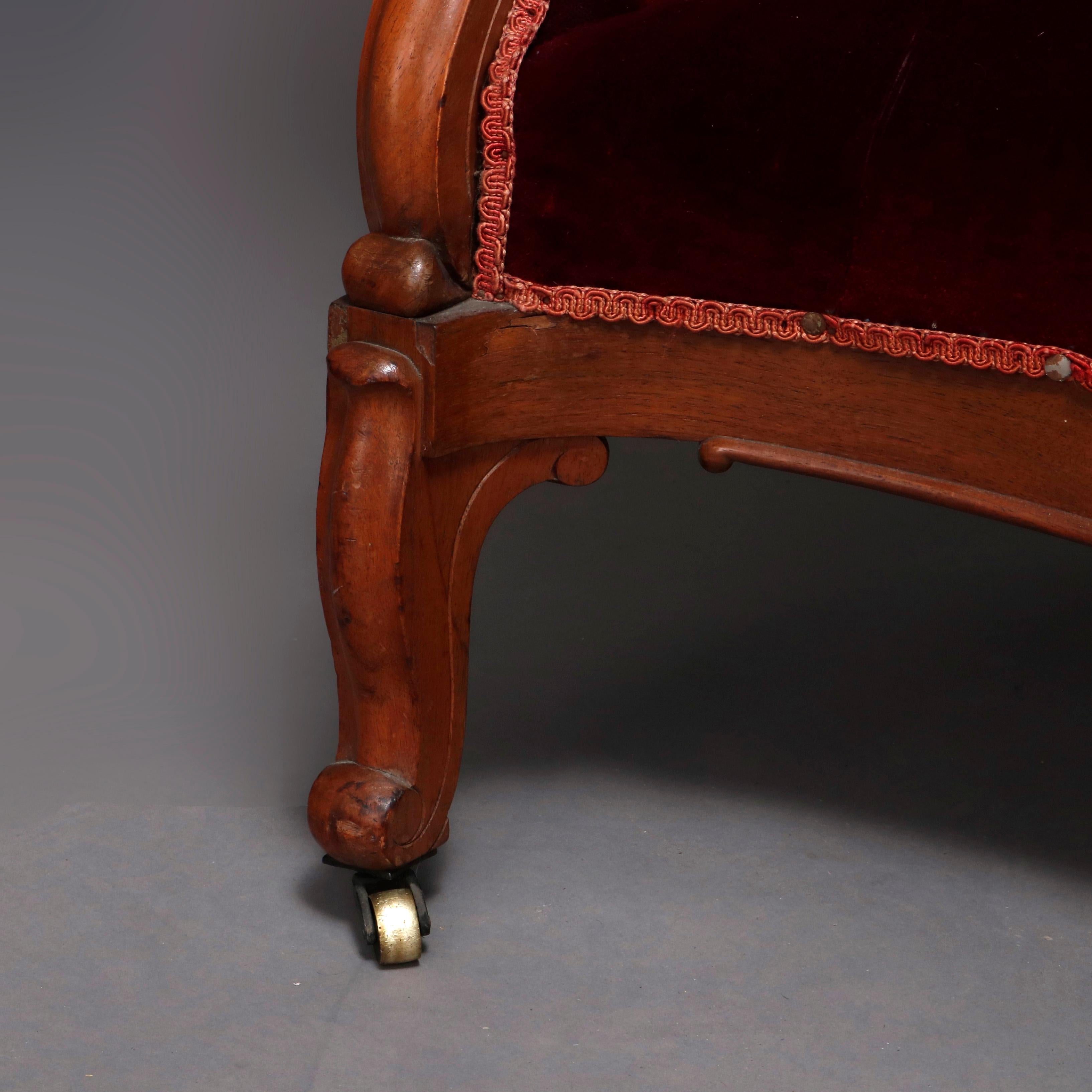 Upholstery Antique Victorian Carved Walnut and Plum Button Back Velvet Sofa, circa 1890